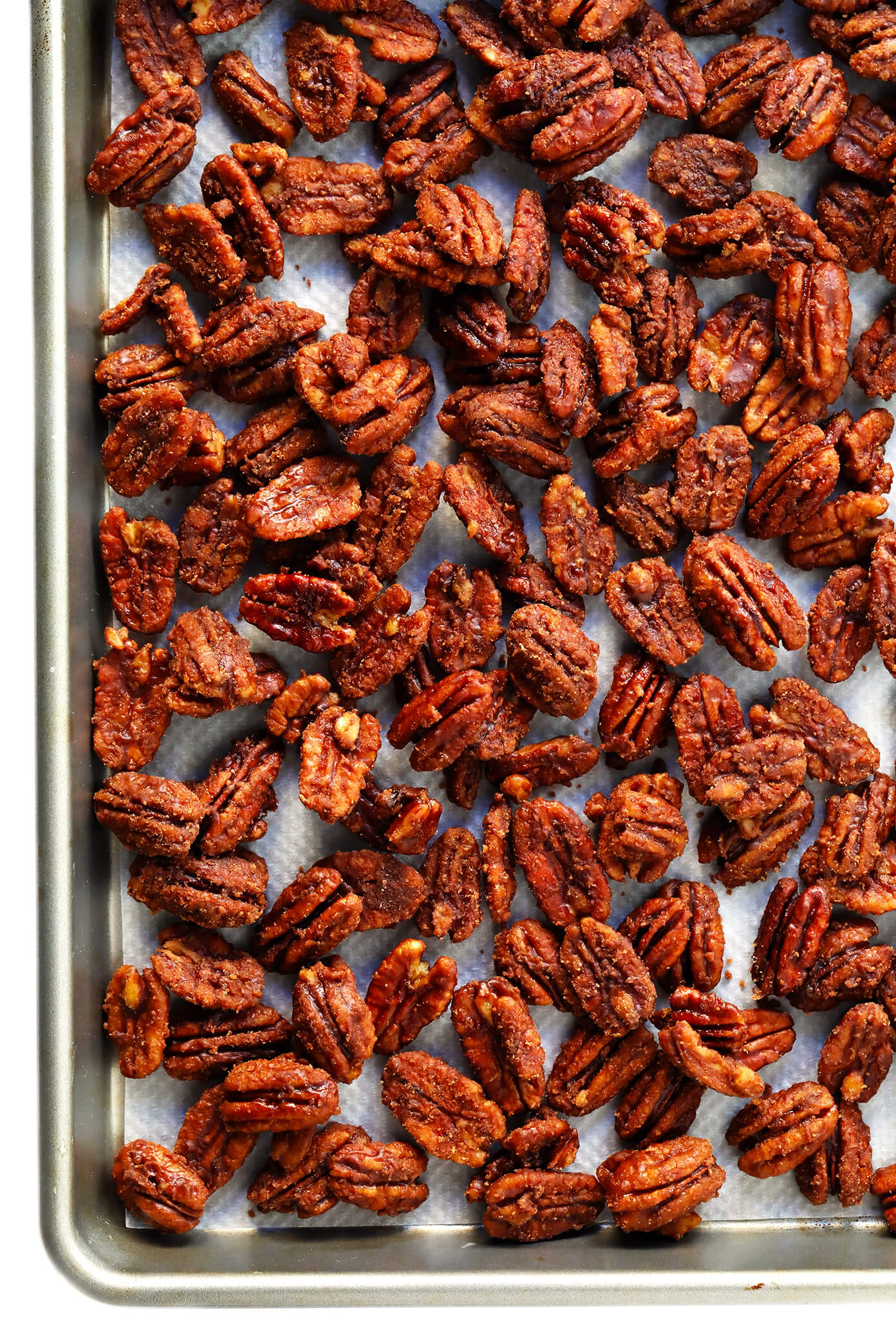 This 5-Ingredient Maple Candied Pecans recipe is irresistibly delicious! It's naturally sweetened with maple syrup, easy to make on the stovetop, and perfect for snacking, sprinkling on salads, or giving away as homemade gifts. | Gimme Some Oven #candied #pecans #glutenfree #vegan #maple #dessert #homemade #gift Naturally-Sweetened Maple Syrup Candied Pecans Recipe