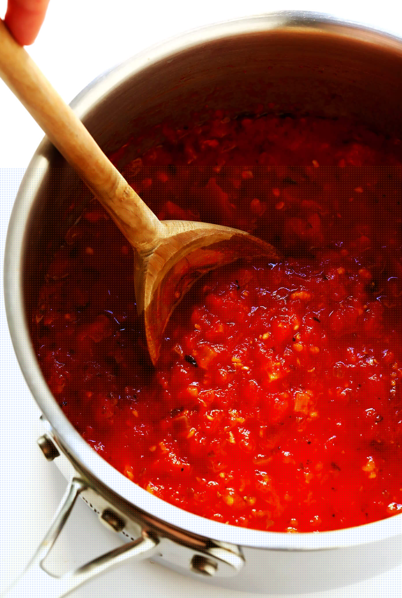 This Spicy Arrabbiata Sauce recipe is a classic Italian marinara made simply with canned tomatoes, garlic, onion, basil, olive oil (or butter), and a generous spoonful of crushed red pepper flakes -- and it is DELICIOUS. Perfect for pasta, gnocchi, pizza, subs or using as a dipping sauce. | gimmesomeoven.com #italian #marinara #tomato #sauce #spicy #pasta #dinner #dipping #healthy Arrabbiata Sauce Recipe
