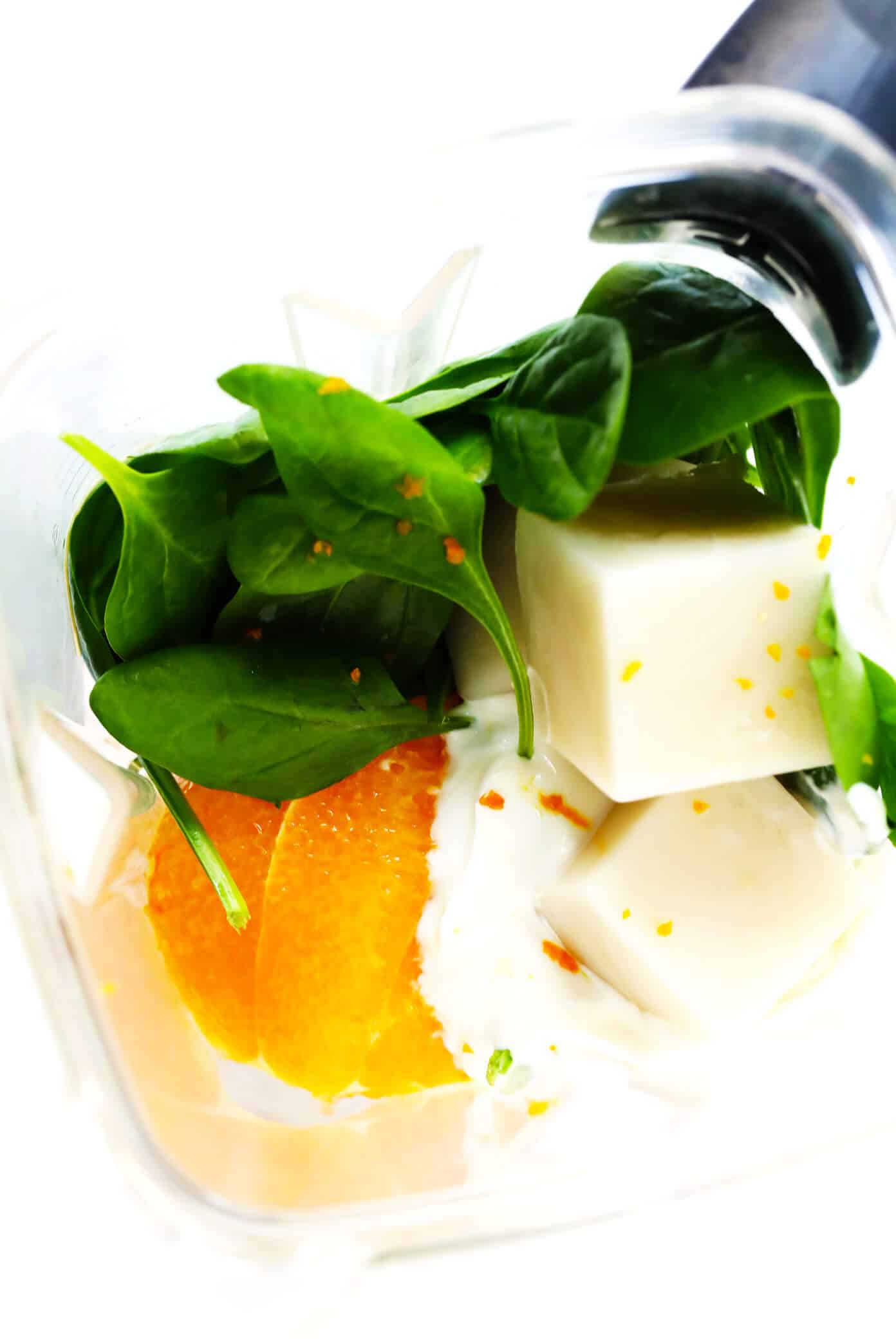 This Green "Julius" Smoothie is inspired by the classic creamy orange smoothie we love, but made with fresh and healthy ingredients and a big handful of spinach. | gimmesomeoven.com #green #smoothie #orange #healthy #glutenfree #healthy #breakfast Green Orange "Julius" Ingredients
