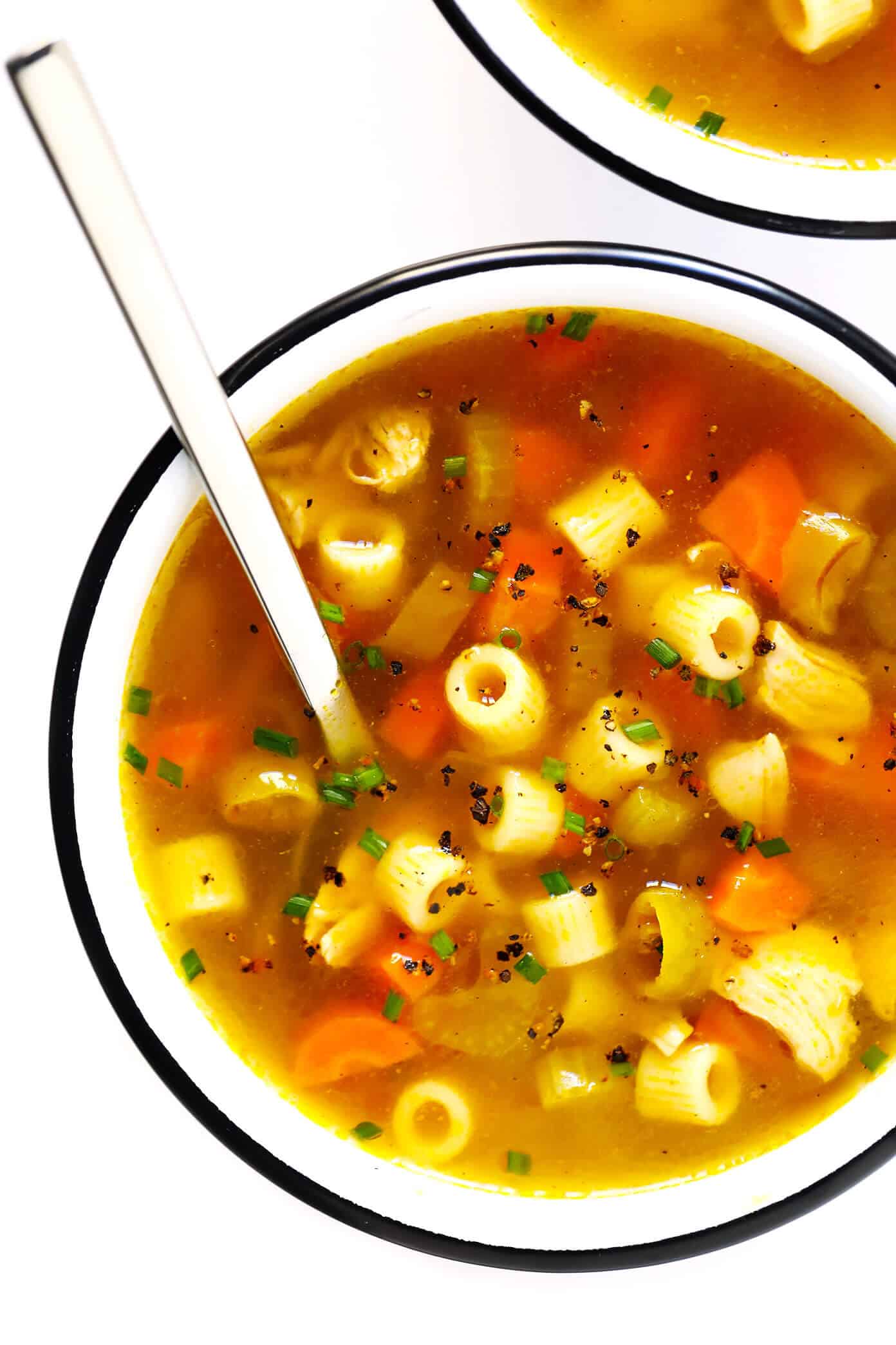 LOVE this Spicy Pepperoncini Chicken Noodle Soup recipe! It's quick and easy to make, and the pepperoncini peppers add the perfect extra bit of heat and tang. Total comfort food! | gimmesomeoven.com #soup #chicken #chickennoodlesoup #pepperoncini #italian #spicy #comfortfood #dinner #recipe Pepperoncini Chicken Noodle Soup