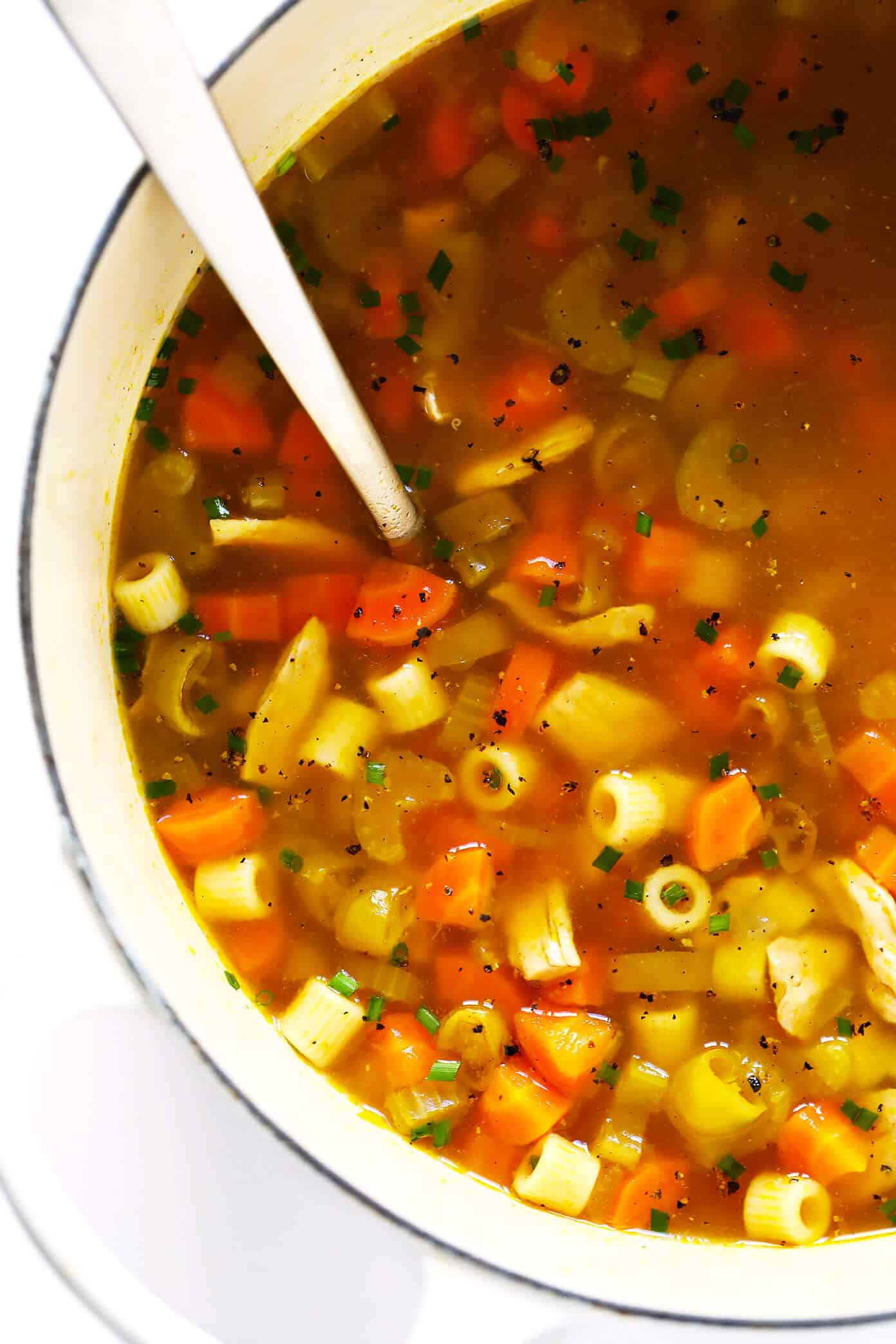 LOVE this Spicy Pepperoncini Chicken Noodle Soup recipe! It's quick and easy to make, and the pepperoncini peppers add the perfect extra bit of heat and tang. Total comfort food! | gimmesomeoven.com #soup #chicken #chickennoodlesoup #pepperoncini #italian #spicy #comfortfood #dinner #recipe Pepperoncini Chicken Noodle Soup Recipe