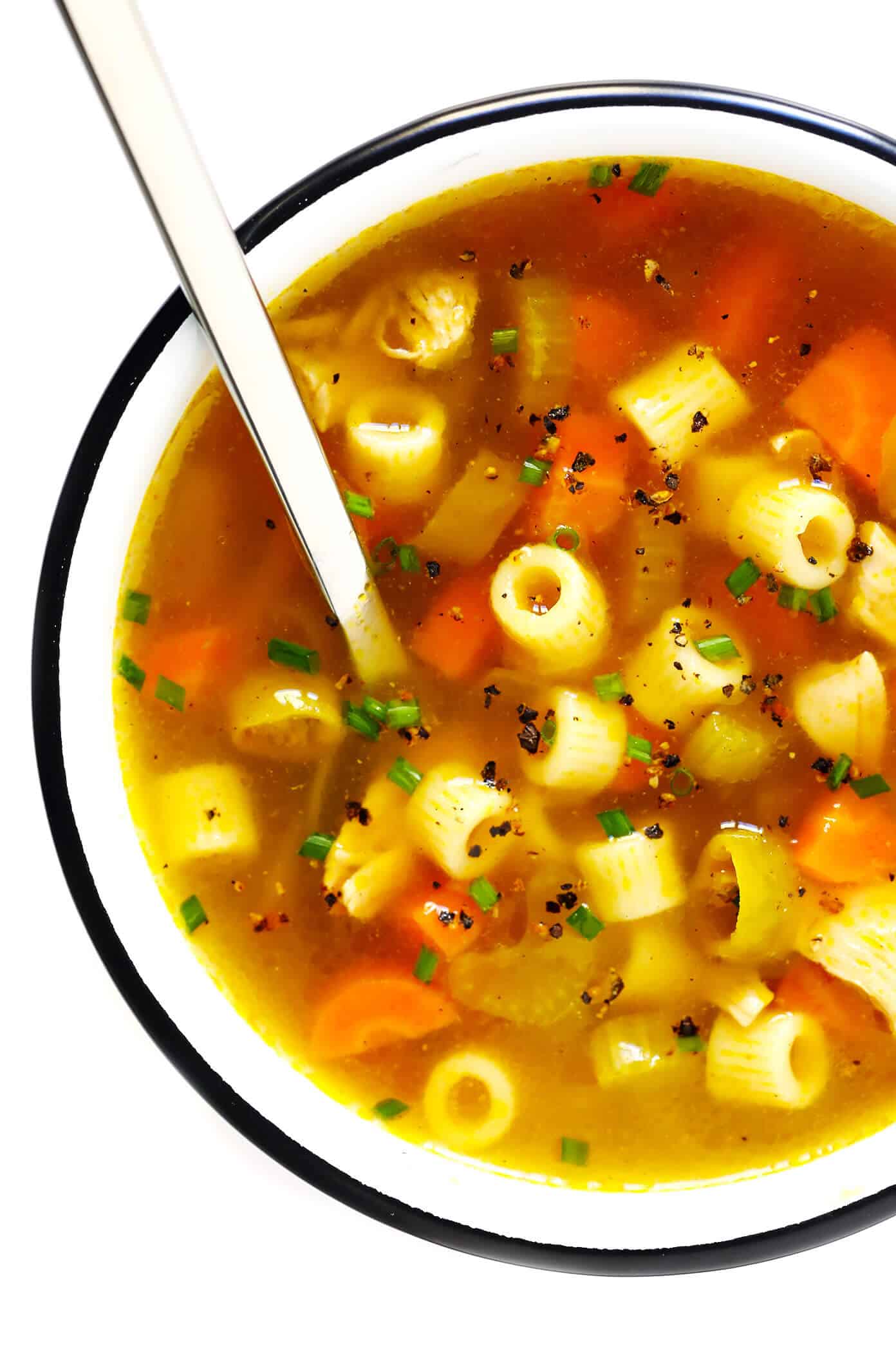 LOVE this Spicy Pepperoncini Chicken Noodle Soup recipe! It's quick and easy to make, and the pepperoncini peppers add the perfect extra bit of heat and tang. Total comfort food! | gimmesomeoven.com #soup #chicken #chickennoodlesoup #pepperoncini #italian #spicy #comfortfood #dinner #recipe Spicy Chicken Noodle Soup with Pepperoncini Peppers