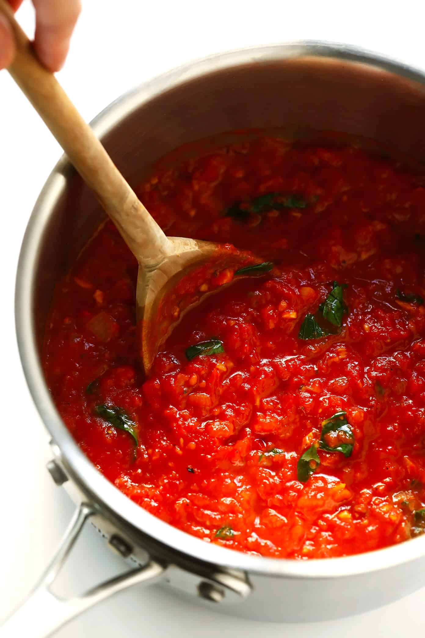 This Spicy Arrabbiata Sauce recipe is a classic Italian marinara made simply with canned tomatoes, garlic, onion, basil, olive oil (or butter), and a generous spoonful of crushed red pepper flakes -- and it is DELICIOUS. Perfect for pasta, gnocchi, pizza, subs or using as a dipping sauce. | gimmesomeoven.com #italian #marinara #tomato #sauce #spicy #pasta #dinner #dipping #healthy Spicy Arrabbiata Sauce with Basil