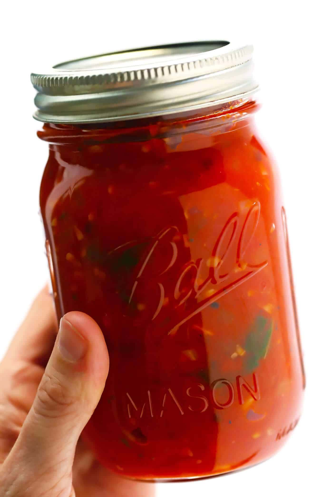 This Spicy Arrabbiata Sauce recipe is a classic Italian marinara made simply with canned tomatoes, garlic, onion, basil, olive oil (or butter), and a generous spoonful of crushed red pepper flakes -- and it is DELICIOUS. Perfect for pasta, gnocchi, pizza, subs or using as a dipping sauce. | gimmesomeoven.com #italian #marinara #tomato #sauce #spicy #pasta #dinner #dipping #healthy Italian Arrabbiata Sauce (Spicy Marinara Sauce)