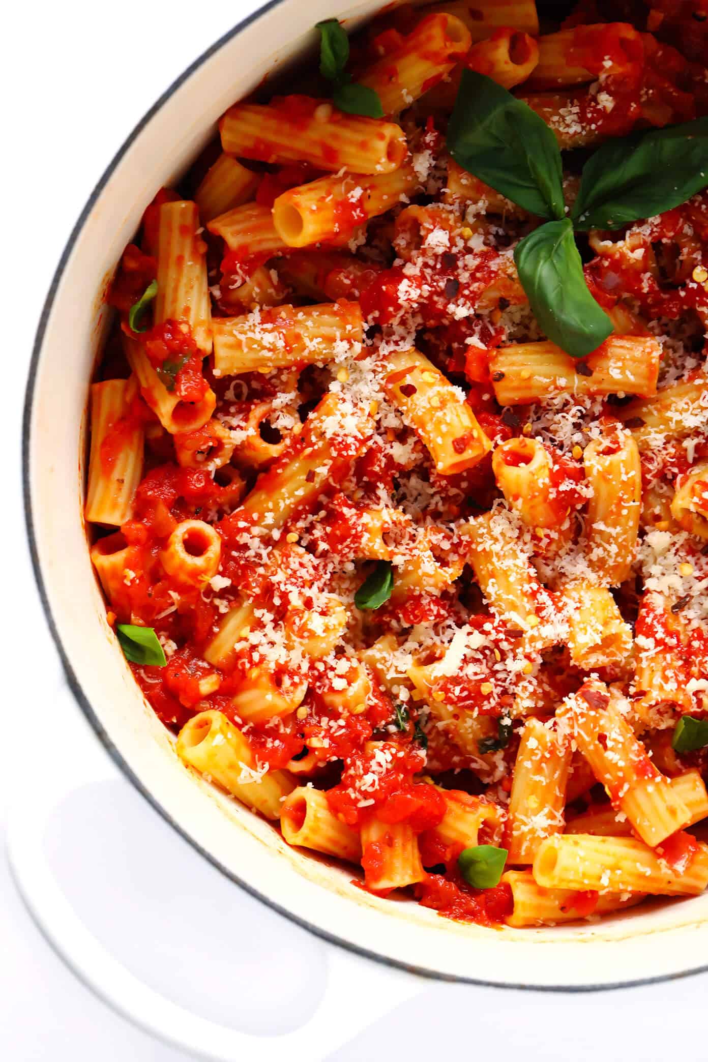 This Spicy Arrabbiata Sauce recipe is a classic Italian marinara made simply with canned tomatoes, garlic, onion, basil, olive oil (or butter), and a generous spoonful of crushed red pepper flakes -- and it is DELICIOUS. Perfect for pasta, gnocchi, pizza, subs or using as a dipping sauce. | gimmesomeoven.com #italian #marinara #tomato #sauce #spicy #pasta #dinner #dipping #healthy Penne Arrabbiata
