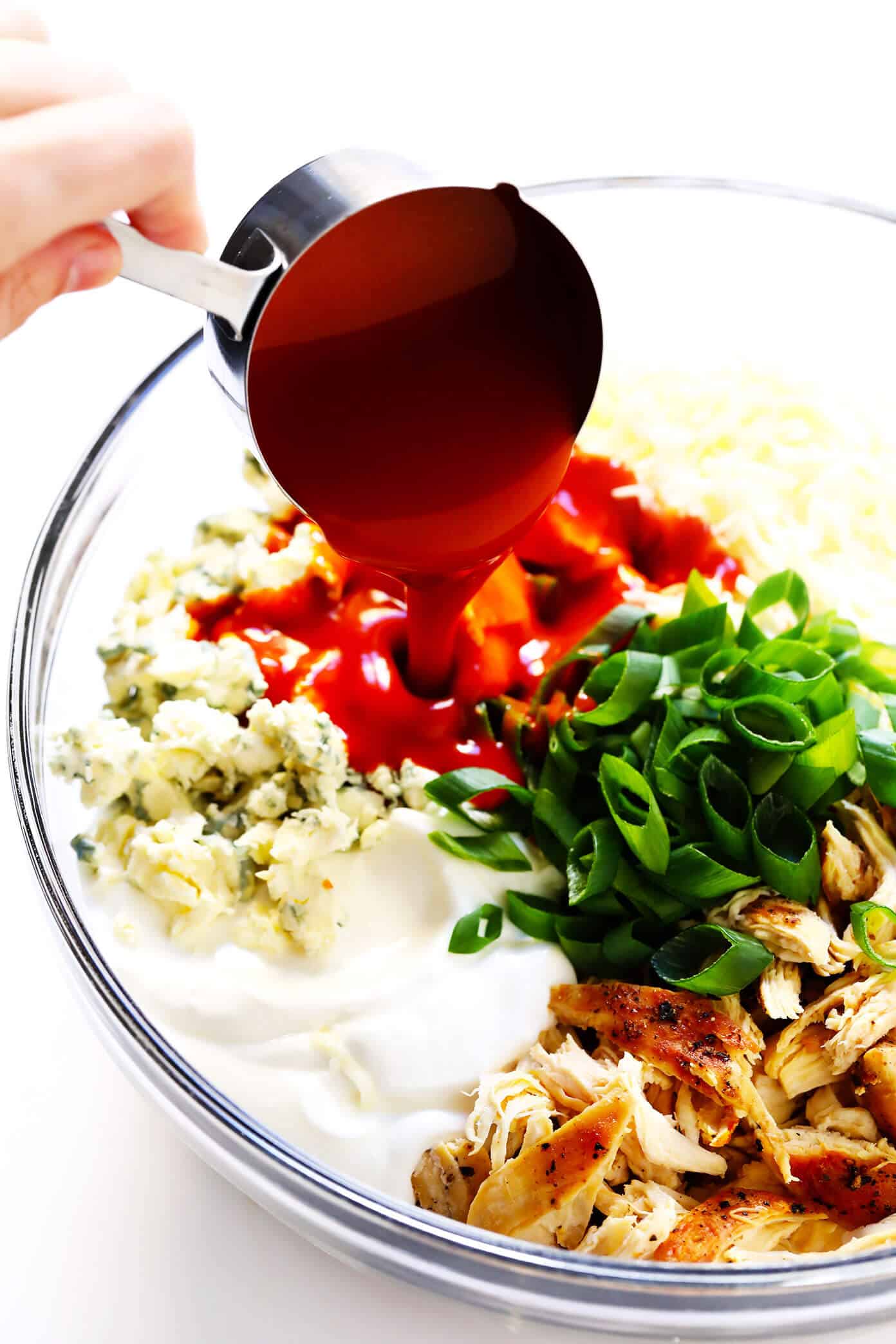 The Best Buffalo Chicken Dip recipe! It's easy to make (in the oven, on the stovetop, or in the slow cooker), full of the best bold flavors, and ALWAYS a crowd fave. | gimmesomeoven.com #dip #appetizer #chicken #superbowl #snack #crockpot Buffalo Chicken Dip Ingredients