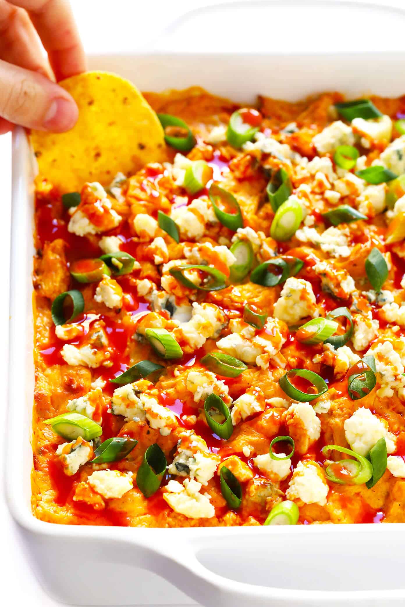 The Best Buffalo Chicken Dip recipe! It's easy to make (in the oven, on the stovetop, or in the slow cooker), full of the best bold flavors, and ALWAYS a crowd fave. | gimmesomeoven.com #dip #appetizer #chicken #superbowl #snack #crockpot Buffalo Chicken Dip