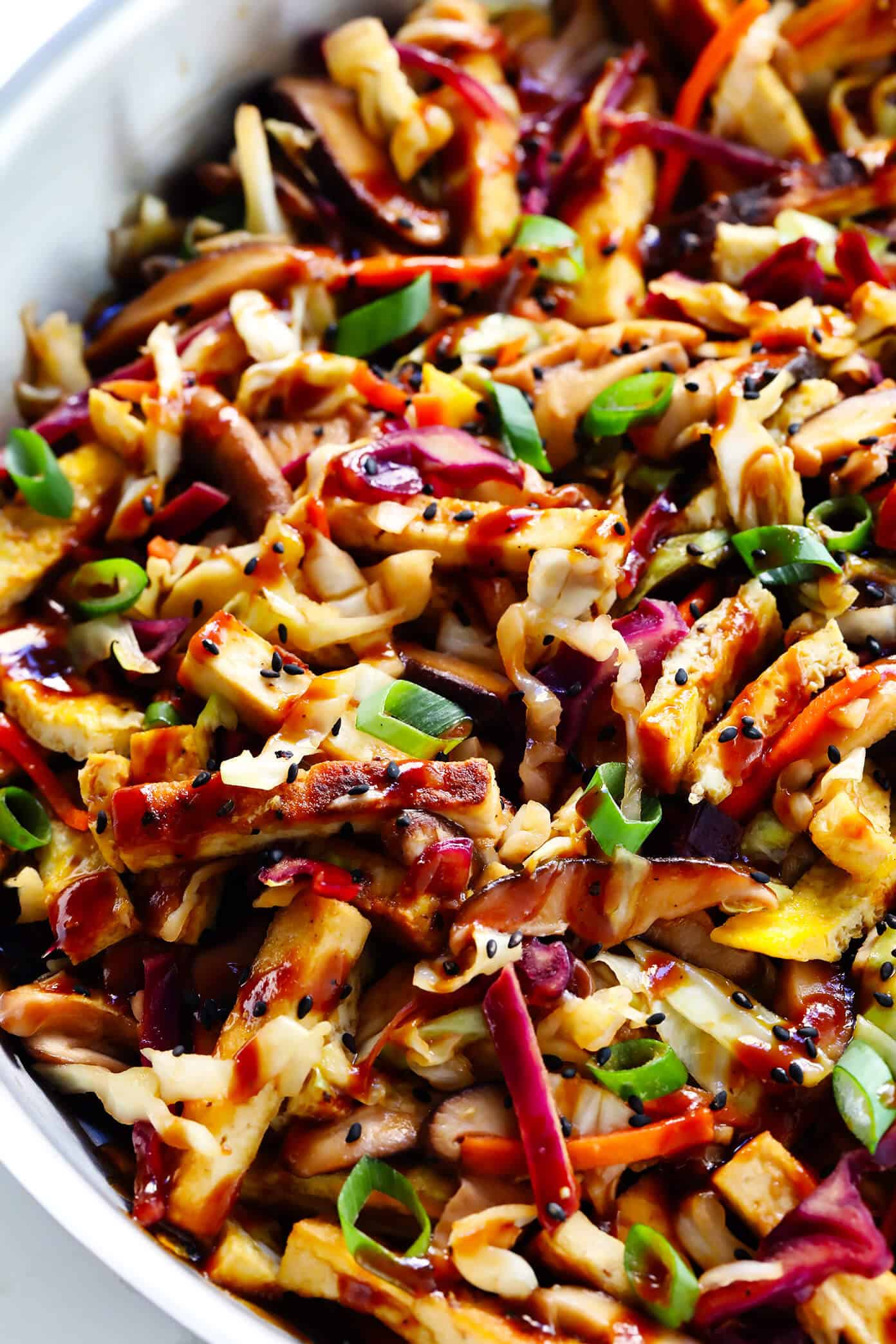 LOVE this Vegetarian Moo Shu recipe! It's made with a healthy veggie stir-fry, crispy tofu, eggs, and the most delicious hoisin sesame sauce. Feel free to serve wrapped in tortillas to make "tacos", or over rice, quinoa or salad greens. One of my favorite #vegetarian #dinner recipes! | gimmesomeoven.com #mooshu #chinese #stirfry #tacos #takeout #vegetarian #healthy #sauce Vegetarian Moo Shu Recipe with Crispy Tofu