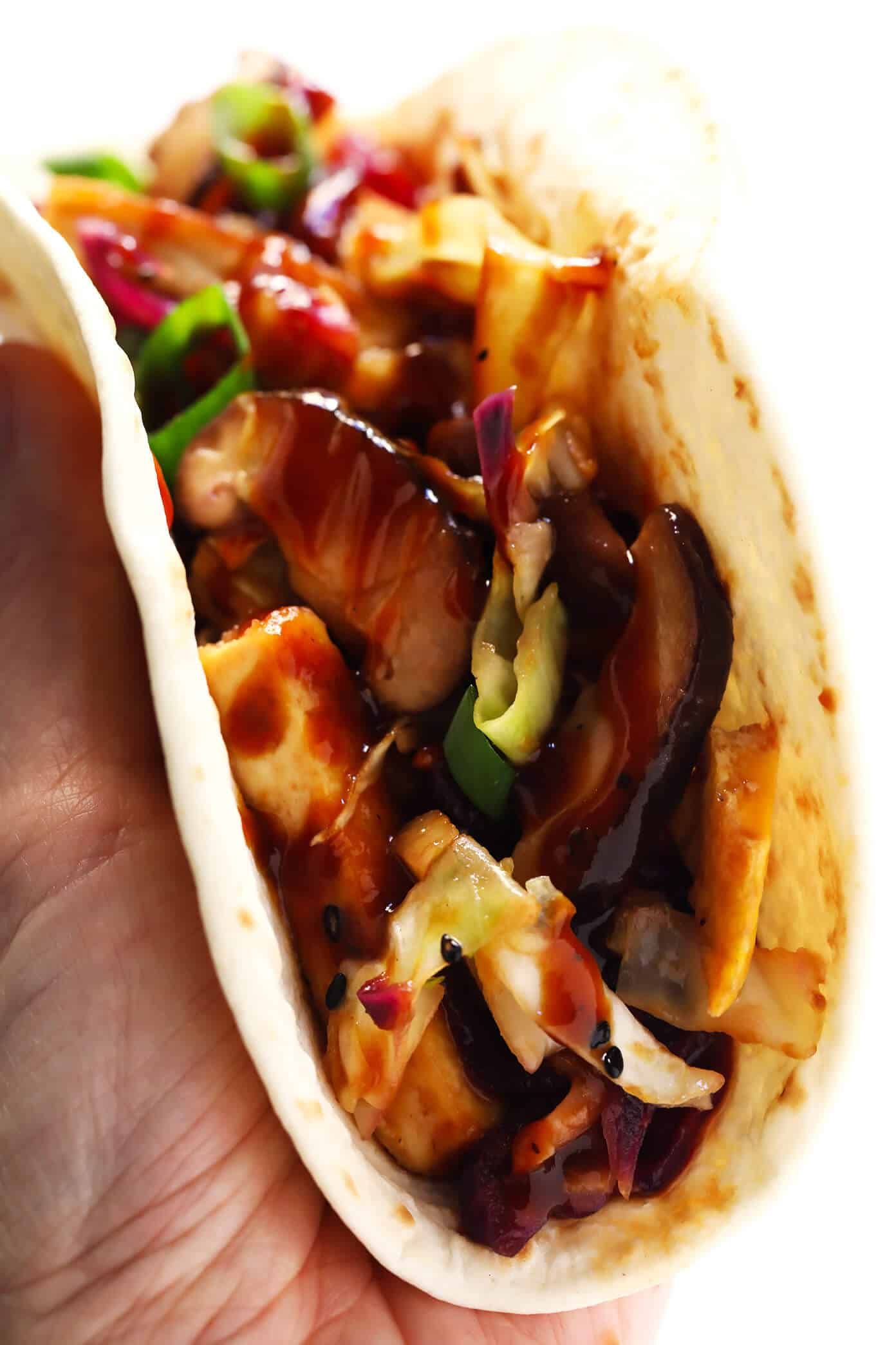 LOVE this Vegetarian Moo Shu recipe! It's made with a healthy veggie stir-fry, crispy tofu, eggs, and the most delicious hoisin sesame sauce. Feel free to serve wrapped in tortillas to make "tacos", or over rice, quinoa or salad greens. One of my favorite #vegetarian #dinner recipes! | gimmesomeoven.com #mooshu #chinese #stirfry #tacos #takeout #vegetarian #healthy #sauce Vegetarian Moo Shu "Tacos"