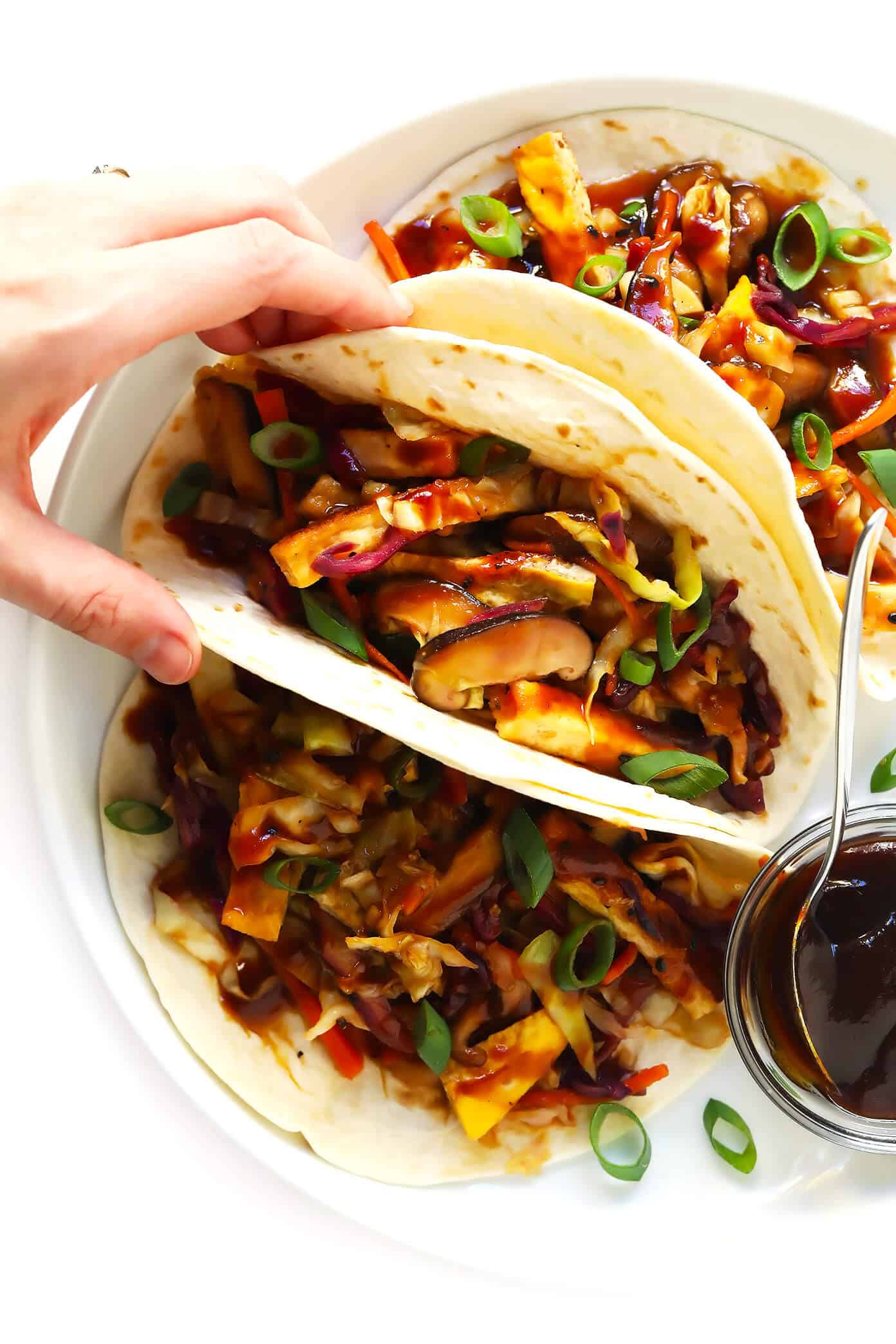 LOVE this Vegetarian Moo Shu recipe! It's made with a healthy veggie stir-fry, crispy tofu, eggs, and the most delicious hoisin sesame sauce. Feel free to serve wrapped in tortillas to make "tacos", or over rice, quinoa or salad greens. One of my favorite #vegetarian #dinner recipes! | gimmesomeoven.com #mooshu #chinese #stirfry #tacos #takeout #vegetarian #healthy #sauce Vegetarian Moo Shu Recipe