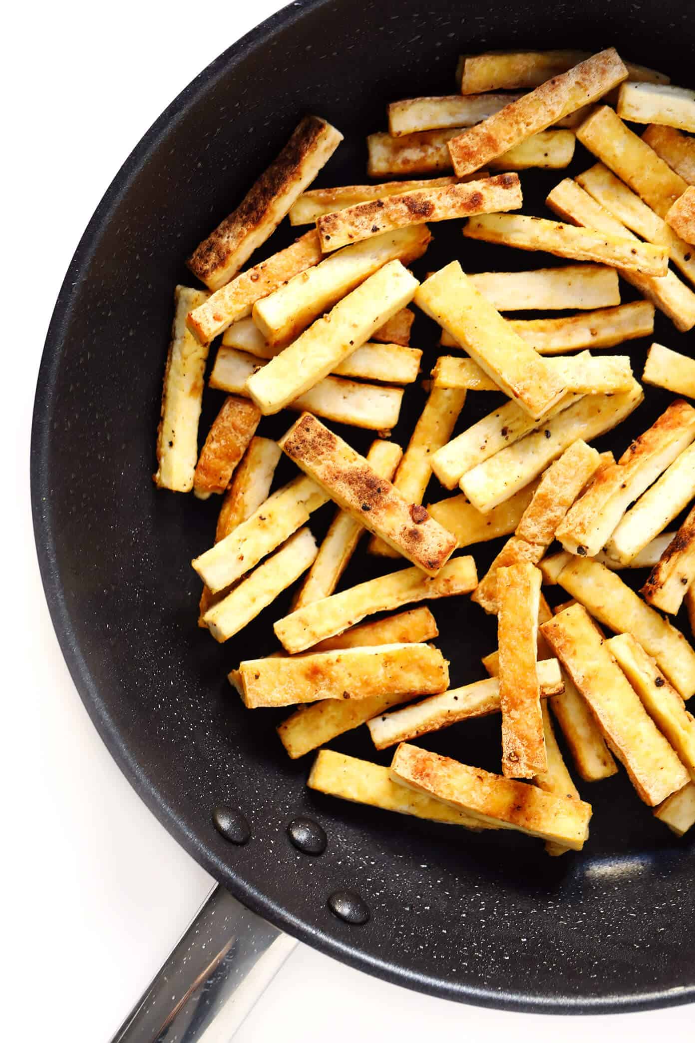 LOVE this Vegetarian Moo Shu recipe! It's made with a healthy veggie stir-fry, crispy tofu, eggs, and the most delicious hoisin sesame sauce. Feel free to serve wrapped in tortillas to make "tacos", or over rice, quinoa or salad greens. One of my favorite #vegetarian #dinner recipes! | gimmesomeoven.com #mooshu #chinese #stirfry #tacos #takeout #vegetarian #healthy #sauce Crispy Tofu for Vegetarian Moo Shu Recipe
