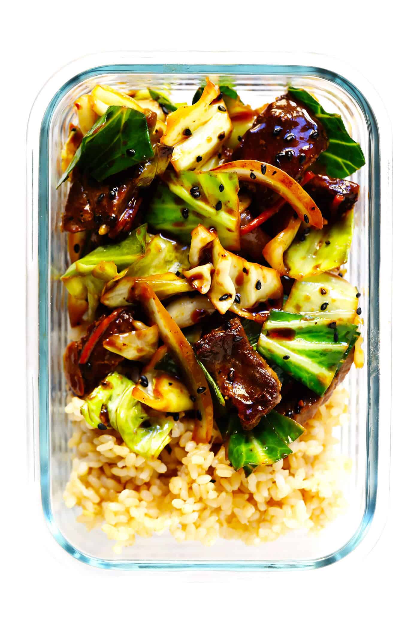This Sesame Beef and Cabbage Stir-Fry recipe is loaded up with lots of tender steak and veggies, tossed in a yummy sesame ginger sauce, and perfect for easy weeknight dinners or healthy meal prep! Serve over rice, noodles, quinoa -- you name it. | gimmesomeoven.com #beef #stirfry #mealprep #dinner #healthy #chinese #rice Meal Prep Beef and Cabbage Stir-Fry with Rice