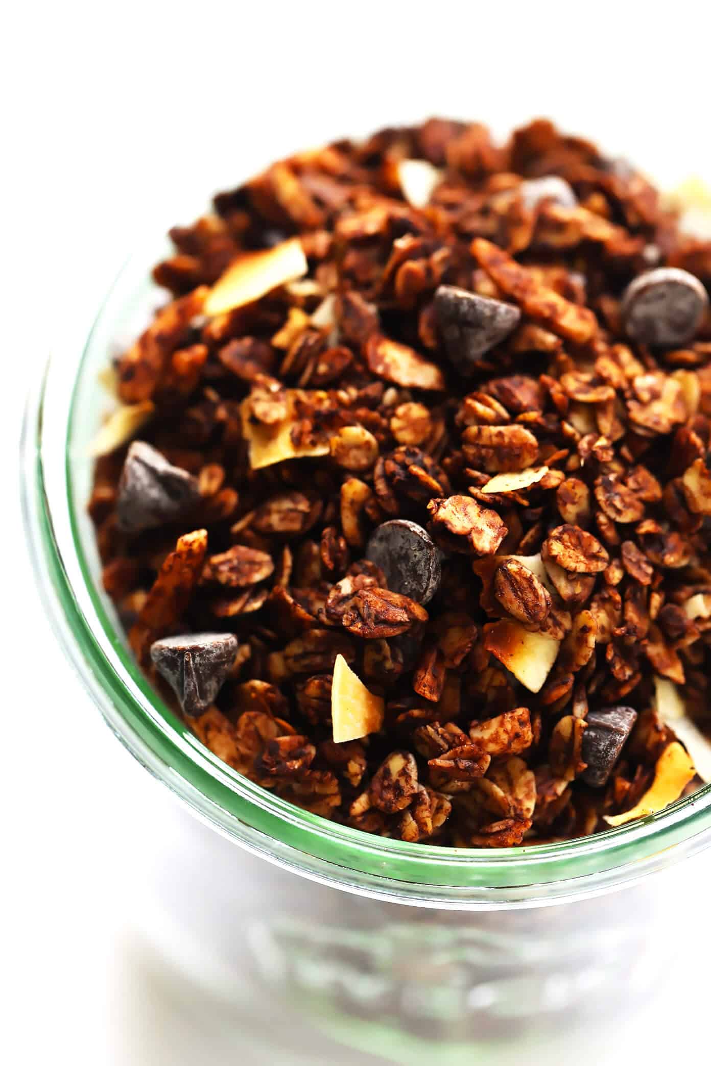 This Healthy Chocolate Granola recipe is super-easy to make, naturally sweetened with honey or maple syrup, and soooo chocolatey and delicious. | gimmesomeoven.com #chocolate #granola #healthy #breakfast #snack #dessert #recipe #glutenfree #vegan Healthy Chocolate Granola with Chocolate Chips