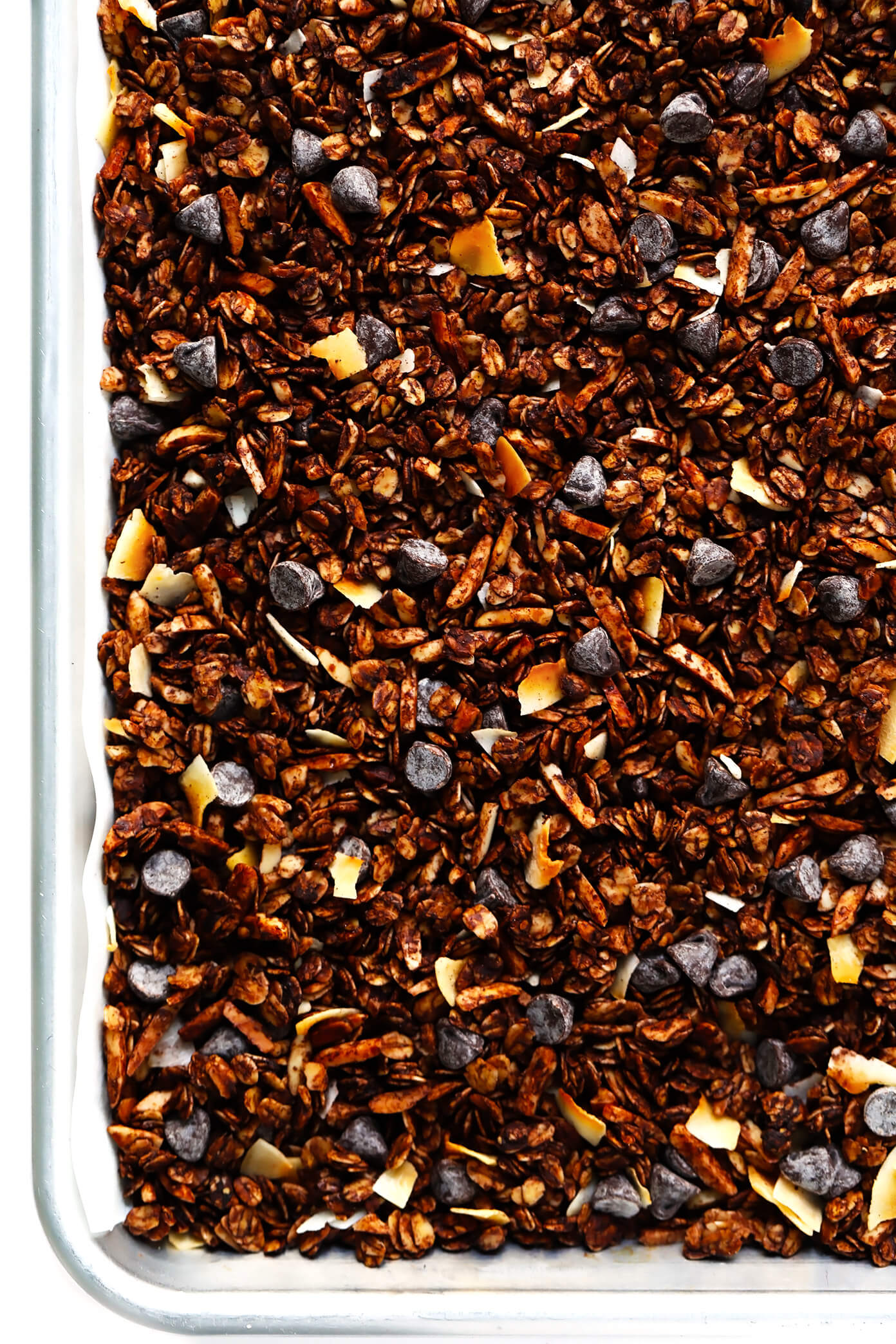 This Healthy Chocolate Granola recipe is super-easy to make, naturally sweetened with honey or maple syrup, and soooo chocolatey and delicious. | gimmesomeoven.com #chocolate #granola #healthy #breakfast #snack #dessert #recipe #glutenfree #vegan Healthy Chocolate Granola with Chocolate Chips