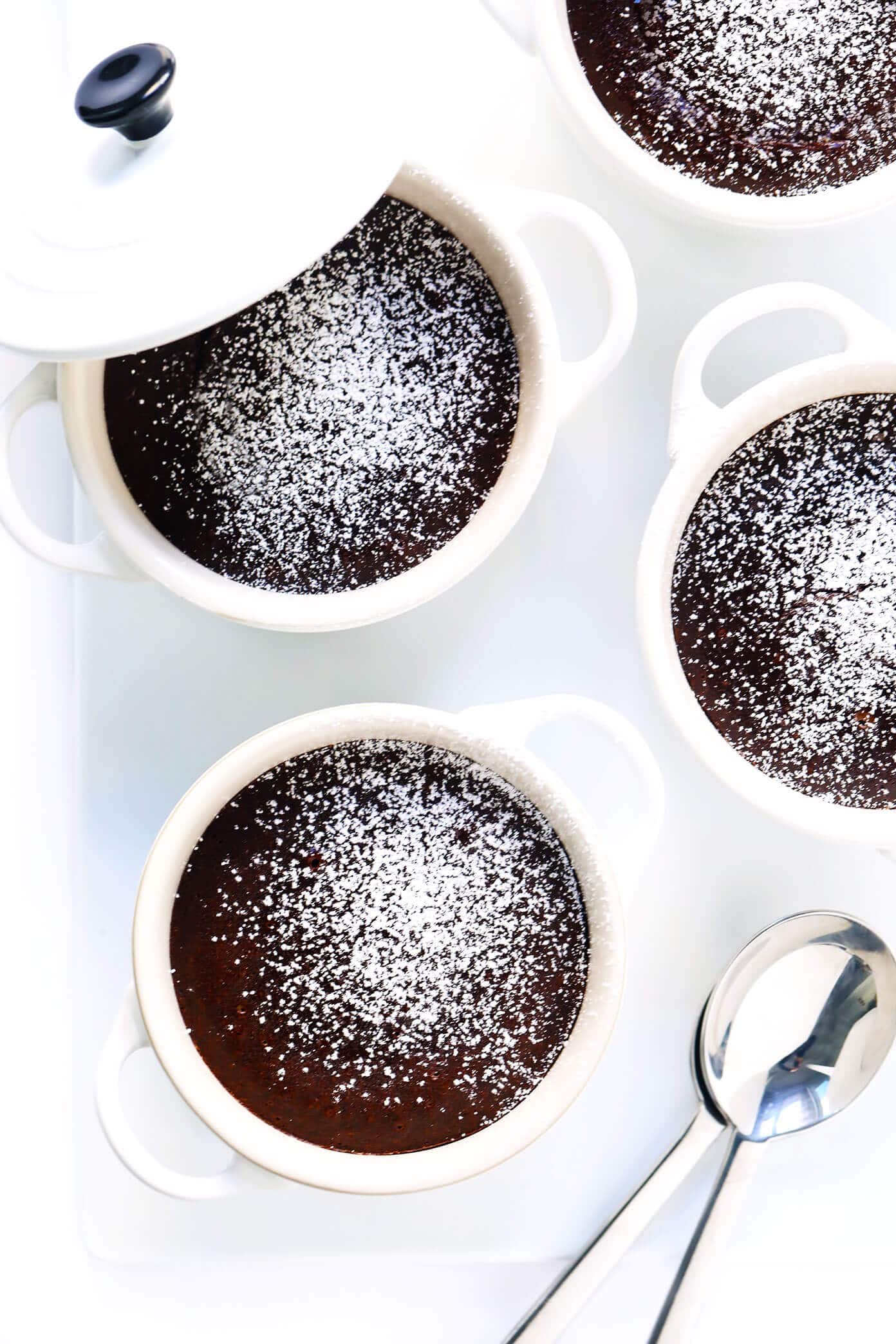 This Dreamy Chocolate Lava Cakes recipe is the BEST! They're quick and easy to make in 20 minutes with just 7 ingredients. And that moist cake with its gooey, molten center is just as rich and decadent and chocolatey as ever. | gimmesomeoven.com #dessert #chocolate #cake #easy #pudding #party #valentines Chocolate Lava Cake