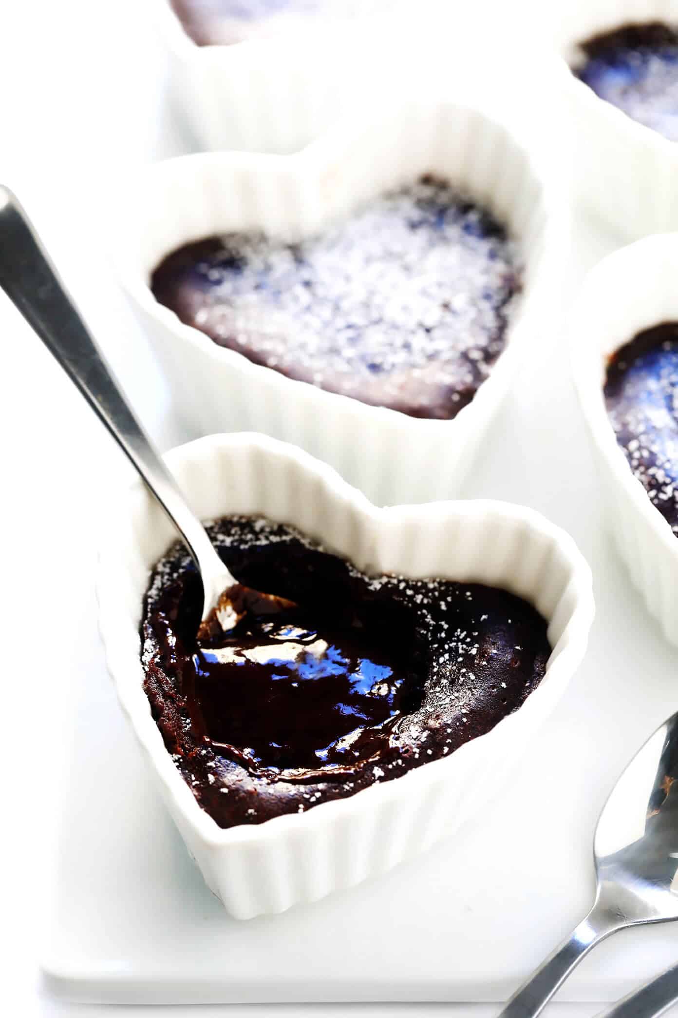 This Dreamy Chocolate Lava Cakes recipe is the BEST! They're quick and easy to make in 20 minutes with just 7 ingredients. And that moist cake with its gooey, molten center is just as rich and decadent and chocolatey as ever. | gimmesomeoven.com #dessert #chocolate #cake #easy #pudding #party #valentines Make-Ahead Chocolate Lava Cakes