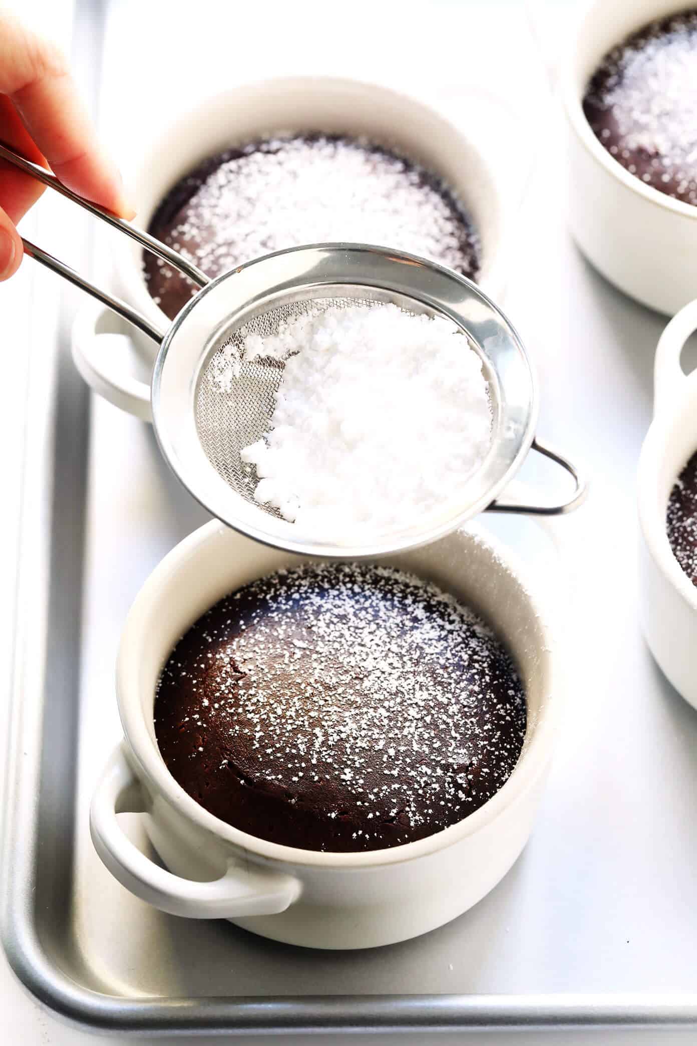 This Dreamy Chocolate Lava Cakes recipe is the BEST! They're quick and easy to make in 20 minutes with just 7 ingredients. And that moist cake with its gooey, molten center is just as rich and decadent and chocolatey as ever. | gimmesomeoven.com #dessert #chocolate #cake #easy #pudding #party #valentines Chocolate Molten Lava Cakes