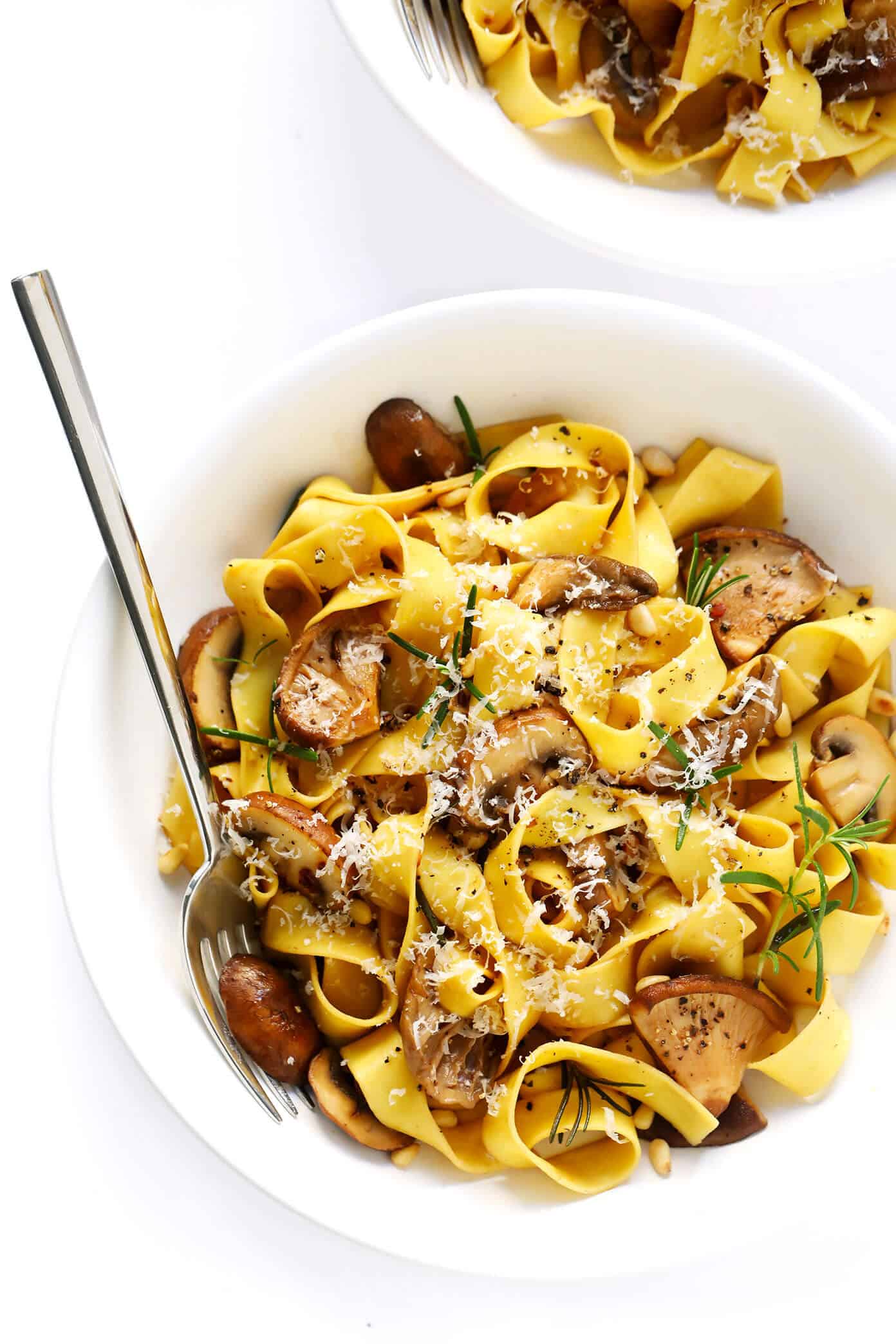 This Mushroom Lovers Pasta recipe is tossed with a heavenly rosemary balsamic butter sauce, lots of Parmesan cheese, pine nuts, and whatever kinds of mushrooms you love. Total (vegetarian!) comfort food. | gimmesomeoven.com #pasta #mushroom #vegetarian #dinner #valentines #cheese #sauce #italian Mushroom Lovers Pasta with Rosemary and Parmesan