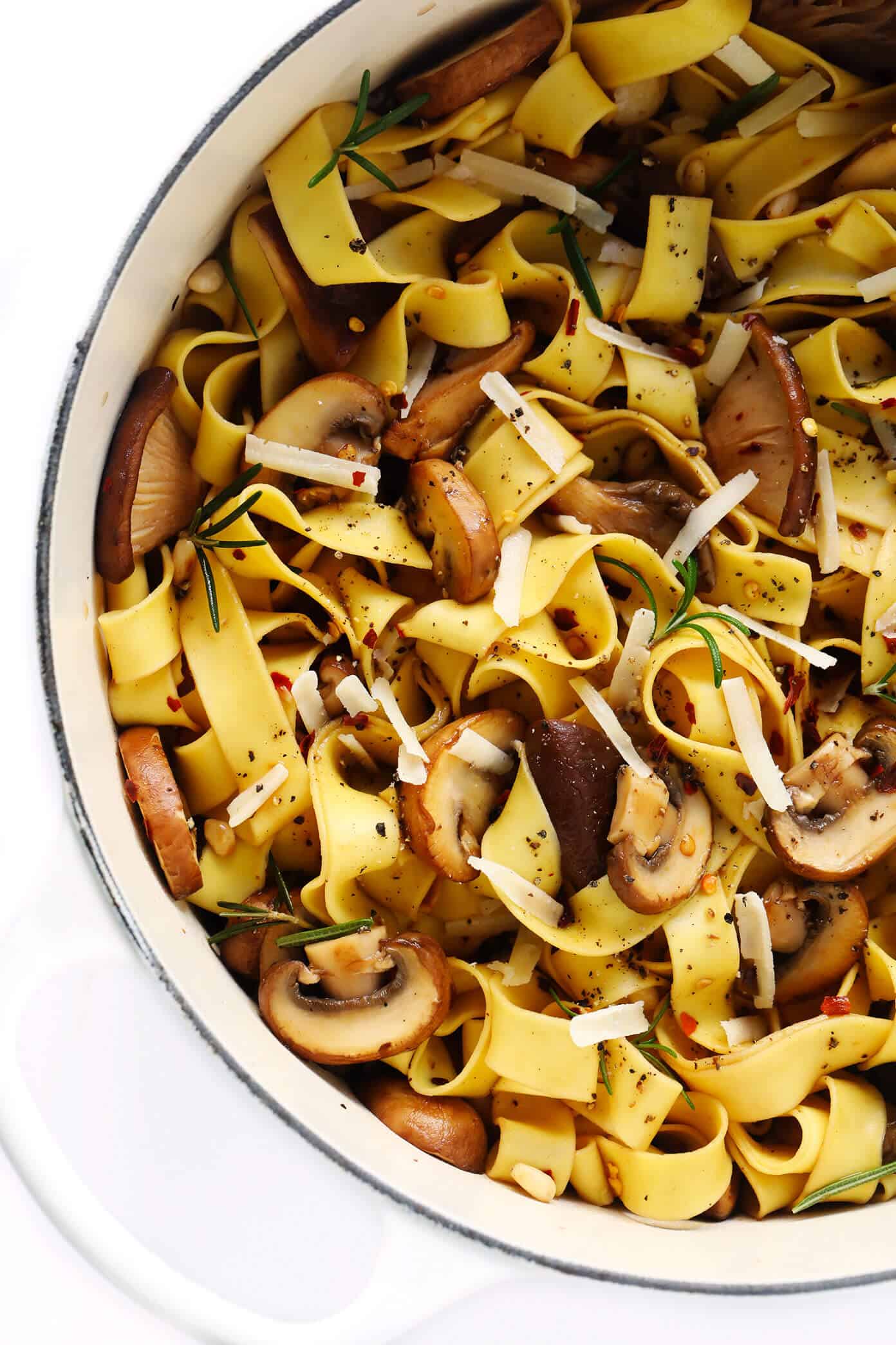 This Mushroom Lovers Pasta recipe is tossed with a heavenly rosemary balsamic butter sauce, lots of Parmesan cheese, pine nuts, and whatever kinds of mushrooms you love. Total (vegetarian!) comfort food. | gimmesomeoven.com #pasta #mushroom #vegetarian #dinner #valentines #cheese #sauce #italian Mushroom Pasta with Parmesan