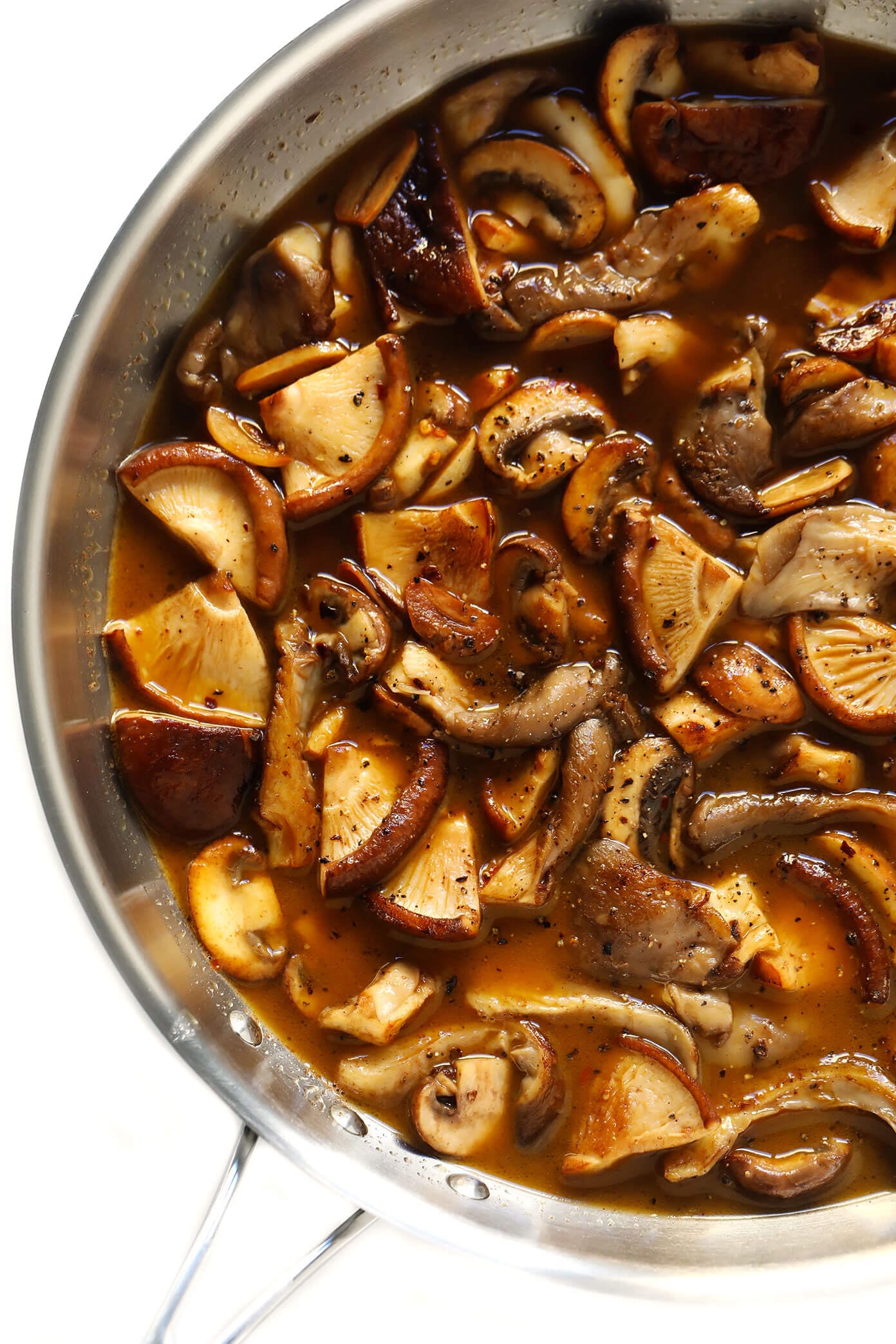 This Mushroom Lovers Pasta recipe is tossed with a heavenly rosemary balsamic butter sauce, lots of Parmesan cheese, pine nuts, and whatever kinds of mushrooms you love. Total (vegetarian!) comfort food. | gimmesomeoven.com #pasta #mushroom #vegetarian #dinner #valentines #cheese #sauce #italian White Wine Balsamic Mushroom Sauce