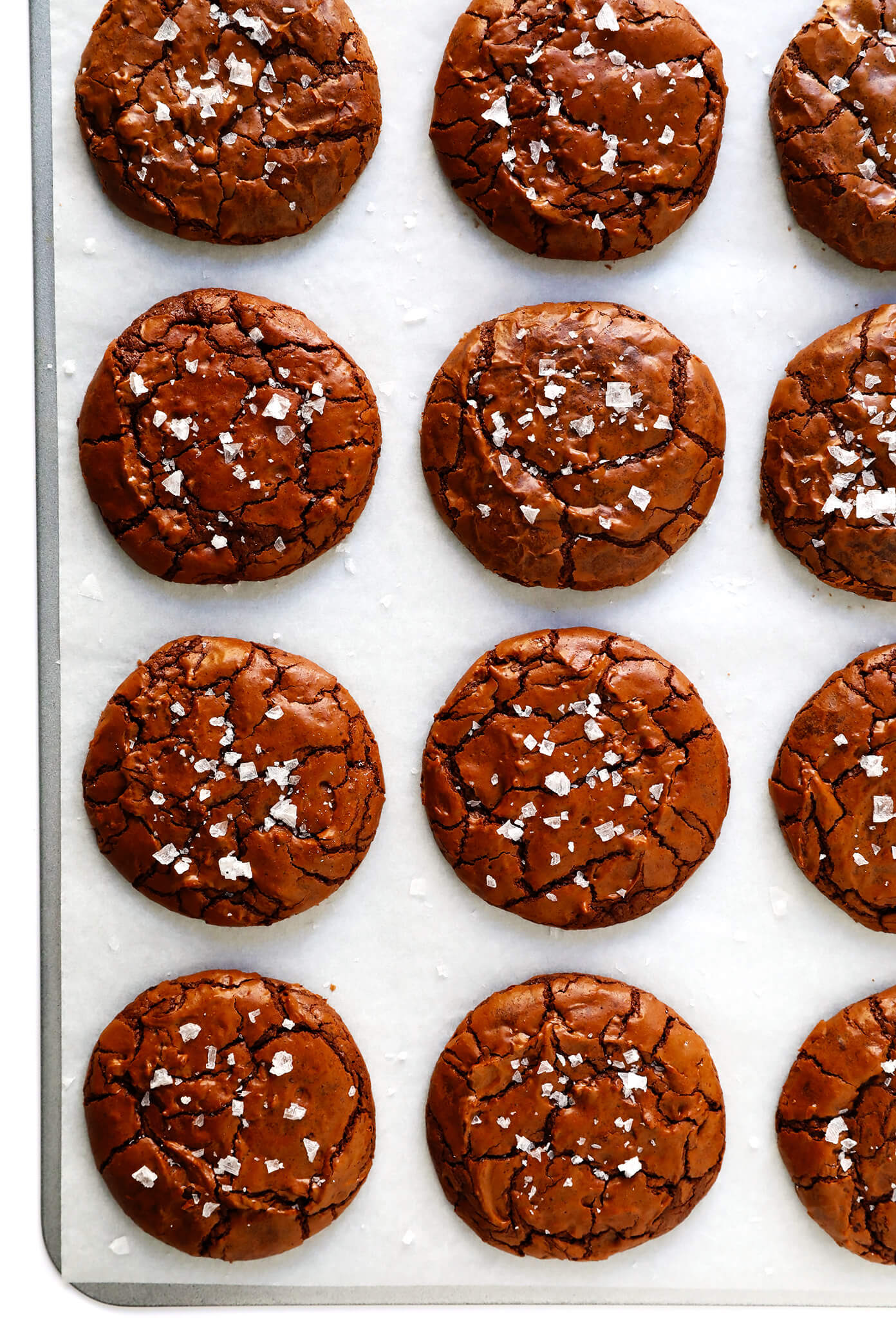 LOVE these salted chocolate brownie cookies! They are perfectly fudgy and rich on the inside, flaky and crinkly on the outside, sprinkled with the perfect crunch of flaky sea salt, and irresistibly DELICIOUS. | gimmesomeoven.com