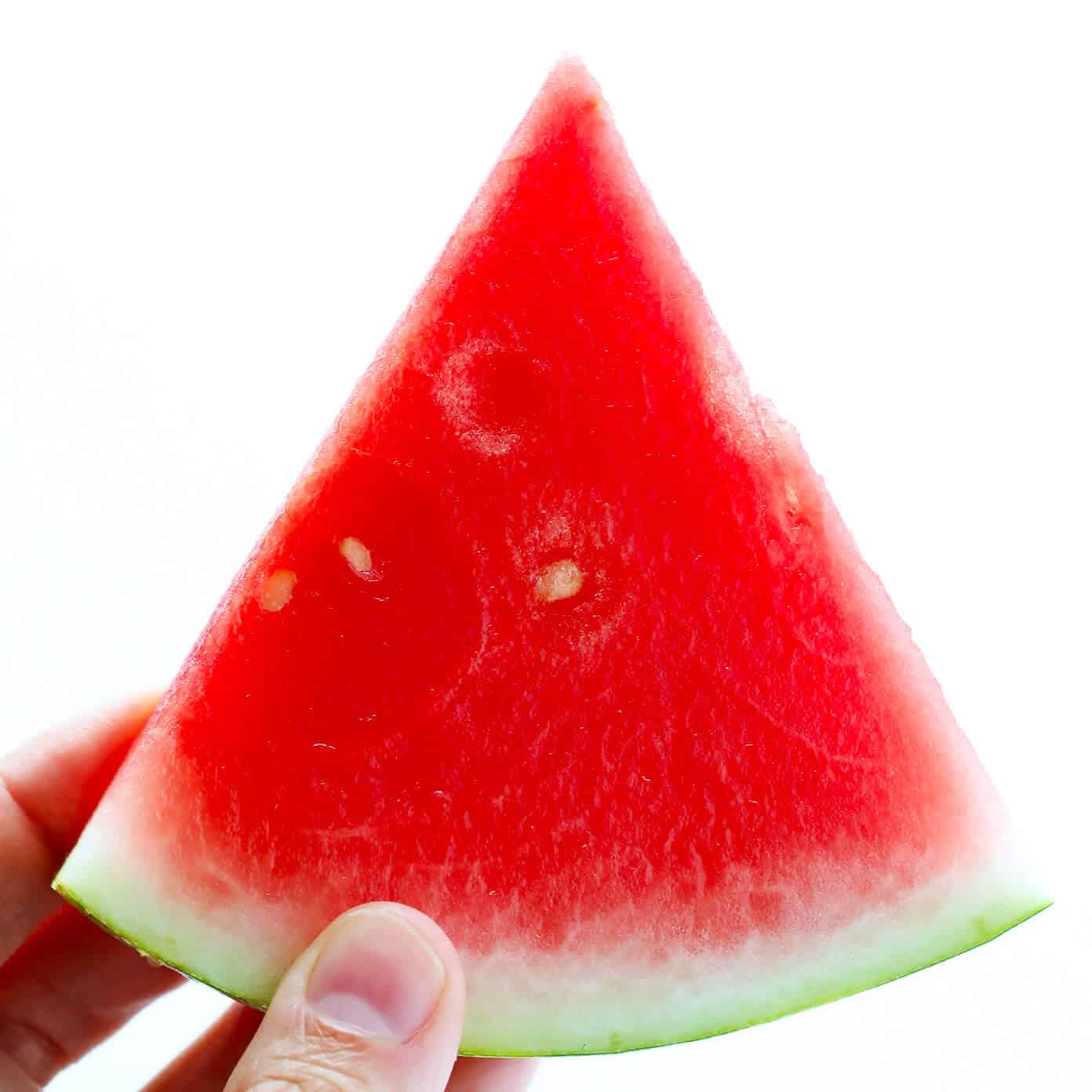 These Watermelon Lime Mocktail recipe is easy to make with just 2 ingredients and kicked up a notch with a fun Tajín rim. It's the perfect frozen slushy for summer! | gimmesomeoven.com #watermelon #mocktail #slushie #slushy #nonalcoholic #drink #frozen #summer Fresh Watermelon For Mocktails