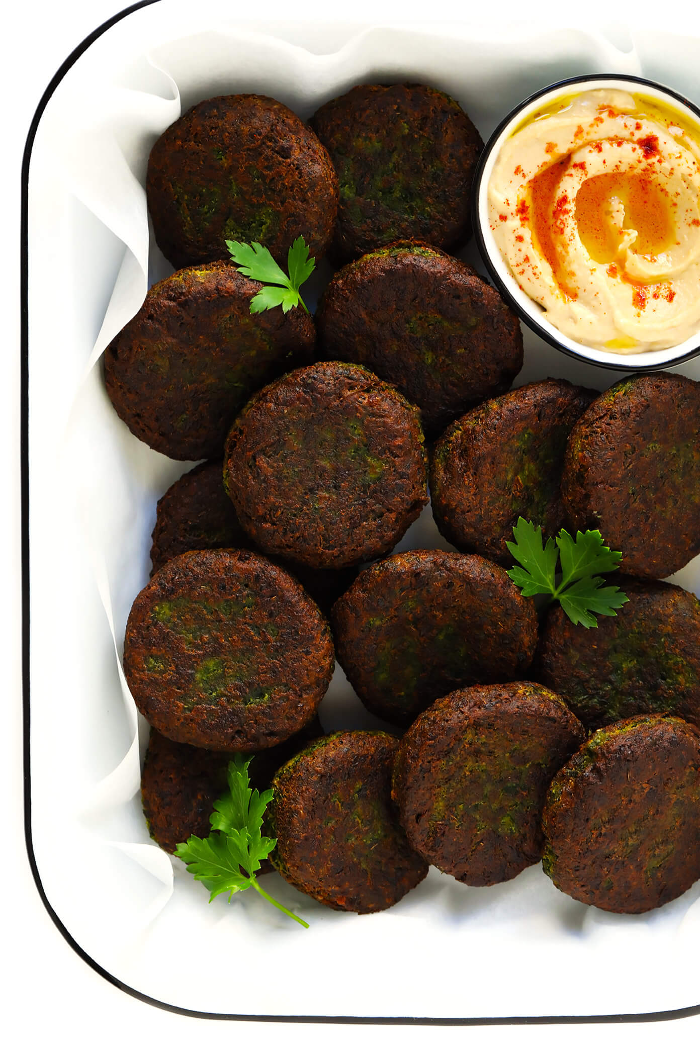Learn how to make falafel with this easy homemade falafel recipe! It's bursting with zesty fresh fresh flavors, lightly pan-fried (instead of deep-fried), and perfect for falafel wraps, salads, sandwiches and more. Bonus, it's also naturally vegan and gluten-free. | gimmesomeoven.com #falafel #wrap #vegetarian #vegan #glutenfree #healthy #dinner #freezermeals Falafel