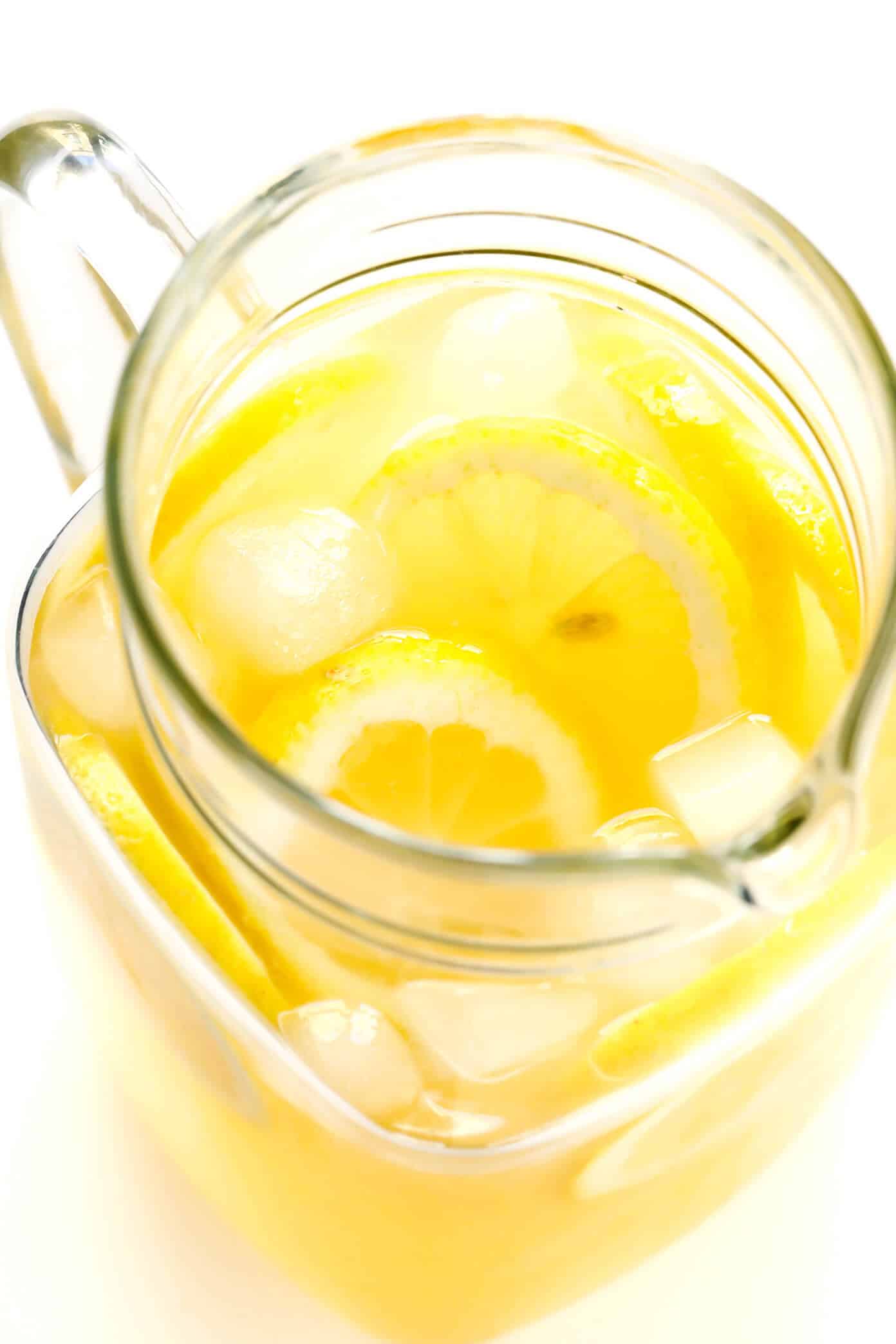The BEST 3-ingredient homemade lemonade recipe -- naturally sweetened with maple syrup or honey, and easy to make in just 5 minutes! | gimmesomeoven.com #lemonade #drink #summer #juice Homemade Lemonade Pitcher
