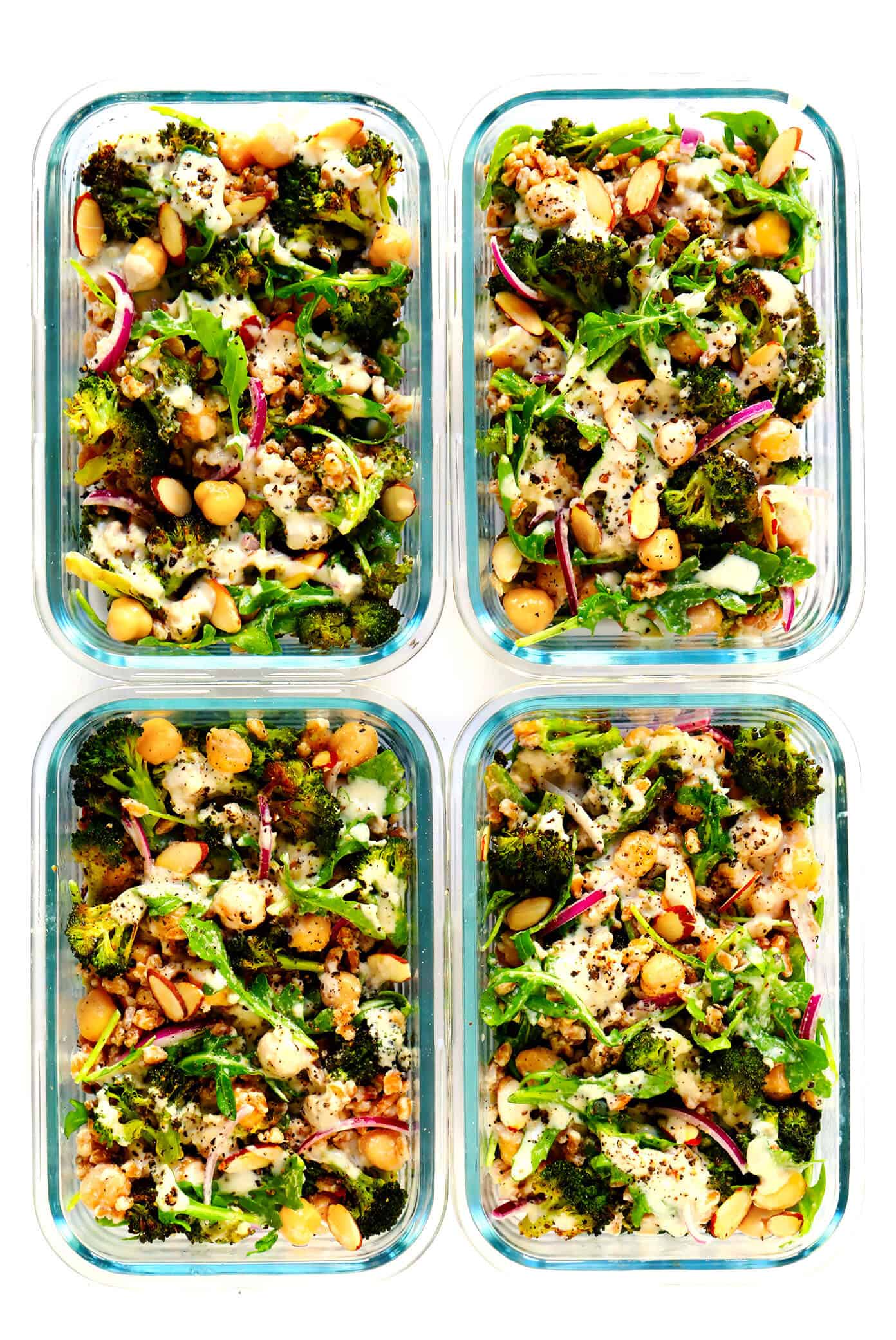 These Roasted Broccoli and Farro Bowls are easy to make with avocado, chickpeas, arugula, red onion, toasted almonds, and the dreamiest tahini dressing. Naturally #glutenfree, #vegetarian, #vegan...and so delicious! | gimmesomeoven.com #broccoli #farro #dinner #healthy #mealprep #grainbowl Healthy Meal Prep