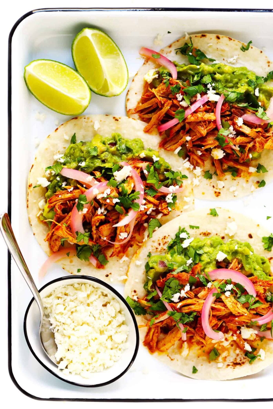 This 5-ingredient cochinita pibil recipe is easy to make in the Instant Pot (pressure cooker) or Crock Pot (slow cooker), it's full of the BEST savory citrus flavors, and this Mexican pulled pork can be served in everything from tacos to burritos, nachos and more. | gimmesomeoven.com #mexican #pork #instantpot #crockpot #tacos #dinner #mealprep Cochinita Pibil
