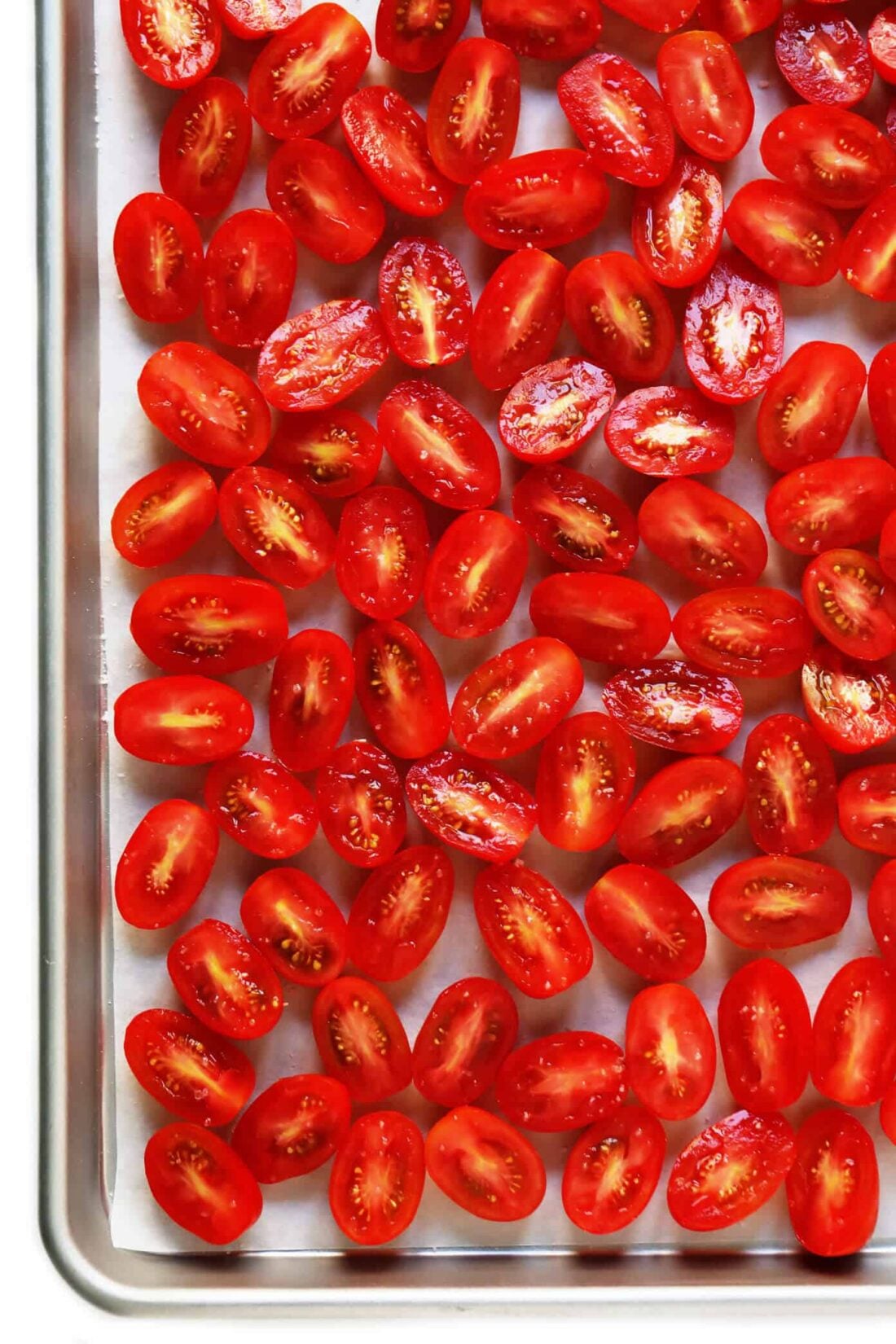 Learn how to make sun-dried tomatoes in the oven! This recipe can be easily customized to be as spicy, garlicky, herby or plain as you prefer. | gimmesomeoven.com #sundriedtomatoes #tomatoes #summer #topping #italian #healthy #vegan #glutenfree Roasted Tomatoes
