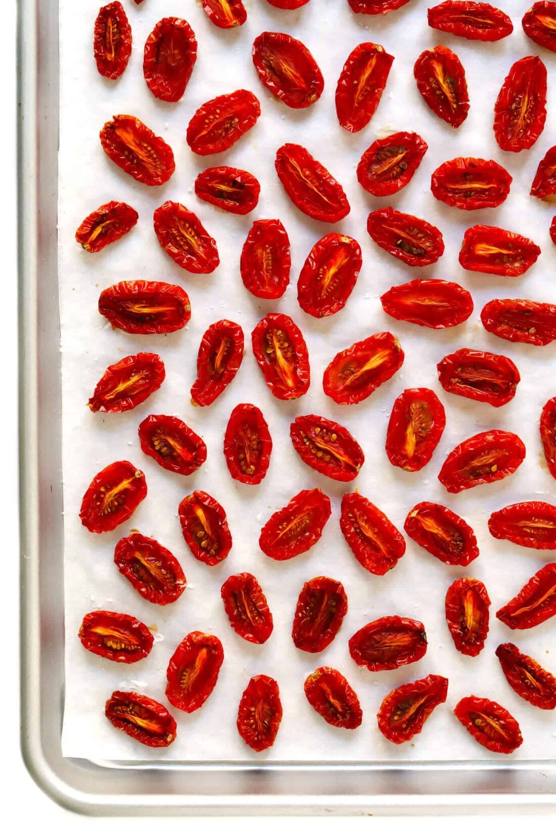 Learn how to make sun-dried tomatoes in the oven! This recipe can be easily customized to be as spicy, garlicky, herby or plain as you prefer. | gimmesomeoven.com #sundriedtomatoes #tomatoes #summer #topping #italian #healthy #vegan #glutenfree Oven-Dried Tomatoes