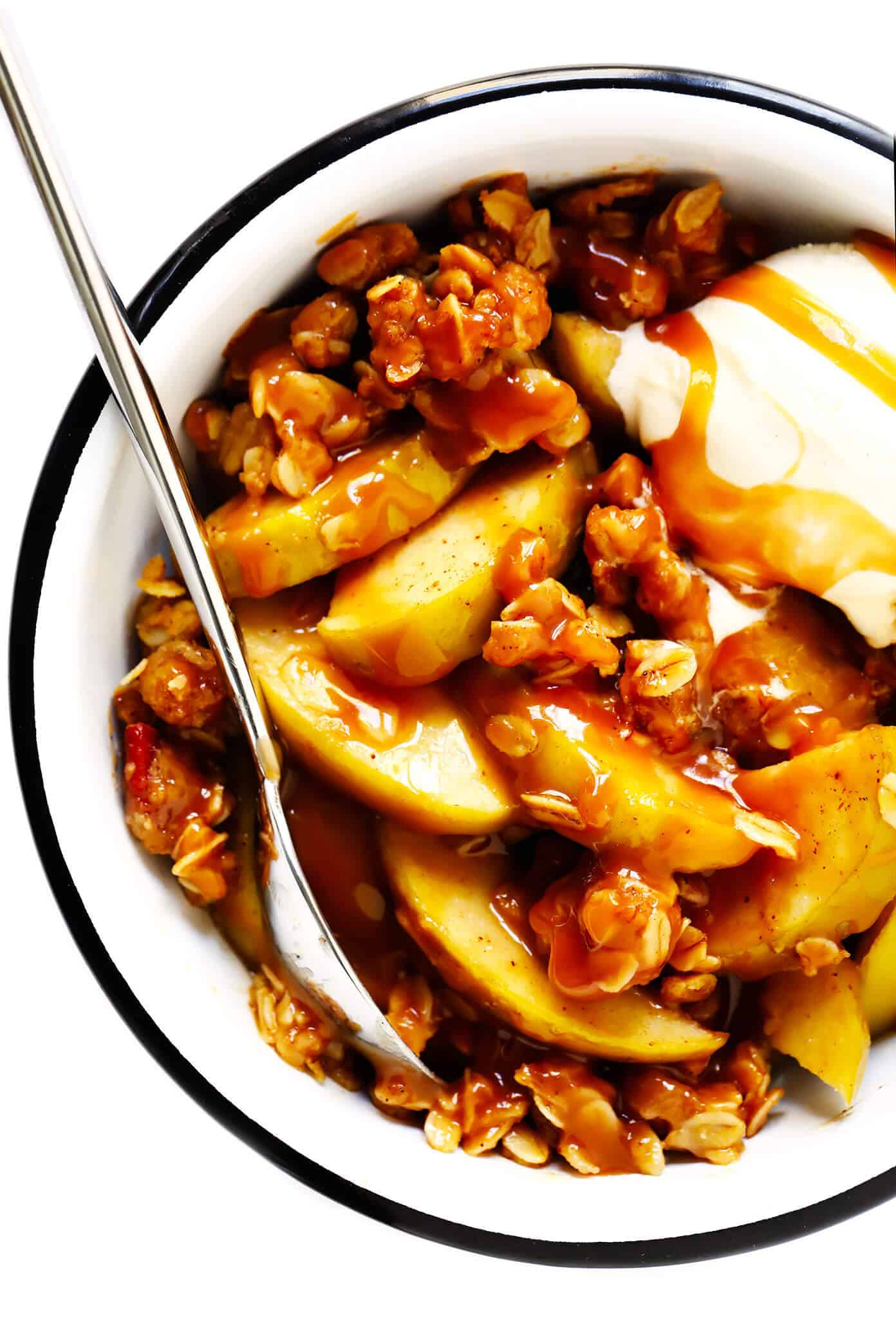 This easy apple crisp recipe (a.k.a. apple crumble) is made with a warm cinnamon apple filling and an irresistible buttery crunchy streusel topping. Plus this no-fuss version takes less than 20 minutes to prep -- the perfect fall dessert recipe! | gimmesomeoven.com #apple #crisp #crumble #dessert #fall #winter #thanksgiving #glutenfree #vegan Easy Apple Crisp with Oatmeal