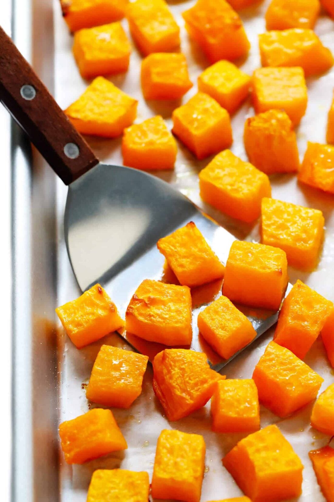 This easy roasted butternut squash recipe can be made with either diced or halved butternut squash. Plus, ideas for various seasonings that you are welcome to add too! | gimmesomeoven.com #roasted #butternut #squash #healthy #vegetable #side #thanksgiving #winter How To Roast Butternut Squash (Diced or Halved)