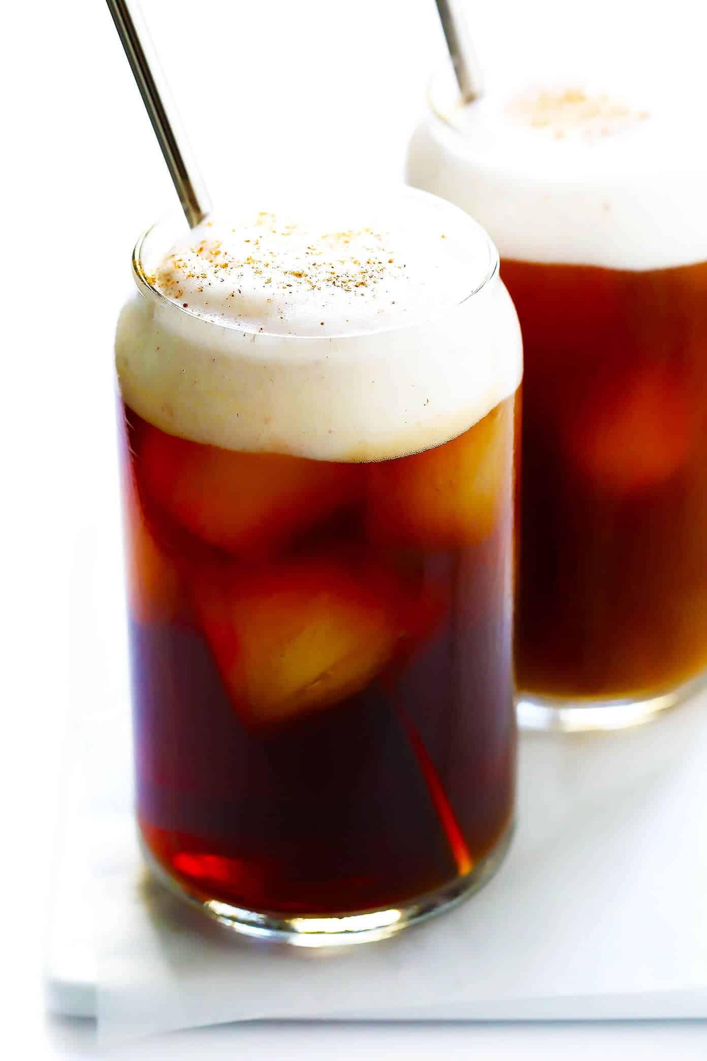This DIY Pumpkin Cream Cold Brew recipe is inspired by the new Starbucks drink and topped with the yummiest pumpkin foam! Feel free to use your favorite kind of iced coffee, plus whichever type of milk and sweetener you prefer. | gimmesomeoven.com #pumpkin #coldbrew #coffee #breakfast #healthy #drink Pumpkin Cream Cold Brew Coffee