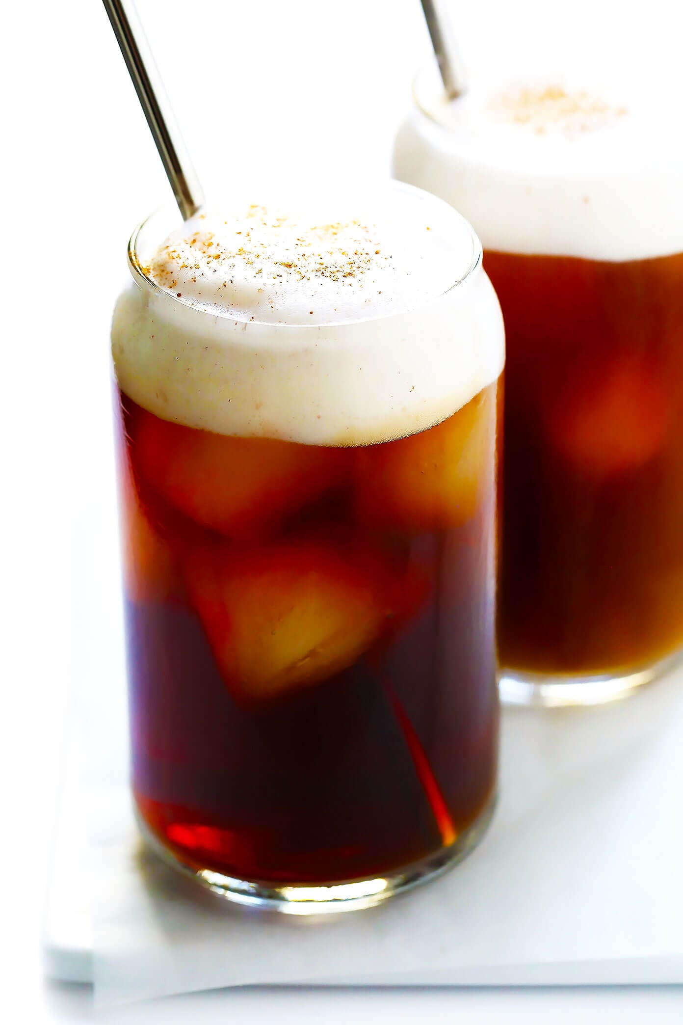 This DIY Pumpkin Cream Cold Brew recipe is inspired by the new Starbucks drink and topped with the yummiest pumpkin foam! Feel free to use your favorite kind of iced coffee, plus whichever type of milk and sweetener you prefer. | gimmesomeoven.com #pumpkin #coldbrew #coffee #breakfast #healthy #drink Pumpkin Cream Cold Brew Coffee (Starbucks Copycat)