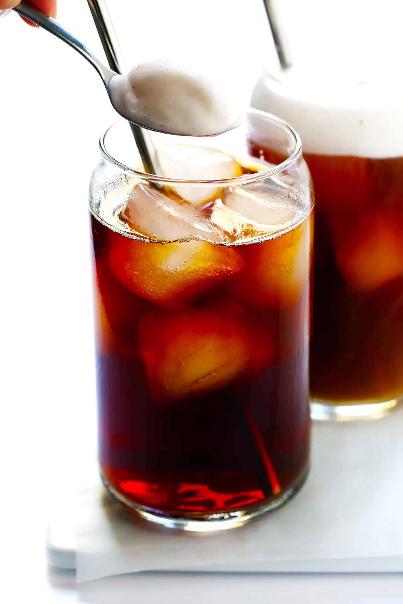This DIY Pumpkin Cream Cold Brew recipe is inspired by the new Starbucks drink and topped with the yummiest pumpkin foam! Feel free to use your favorite kind of iced coffee, plus whichever type of milk and sweetener you prefer. | gimmesomeoven.com #pumpkin #coldbrew #coffee #breakfast #healthy #drink Cold Brew with Pumpkin Cream Foam (Starbucks Copycat)