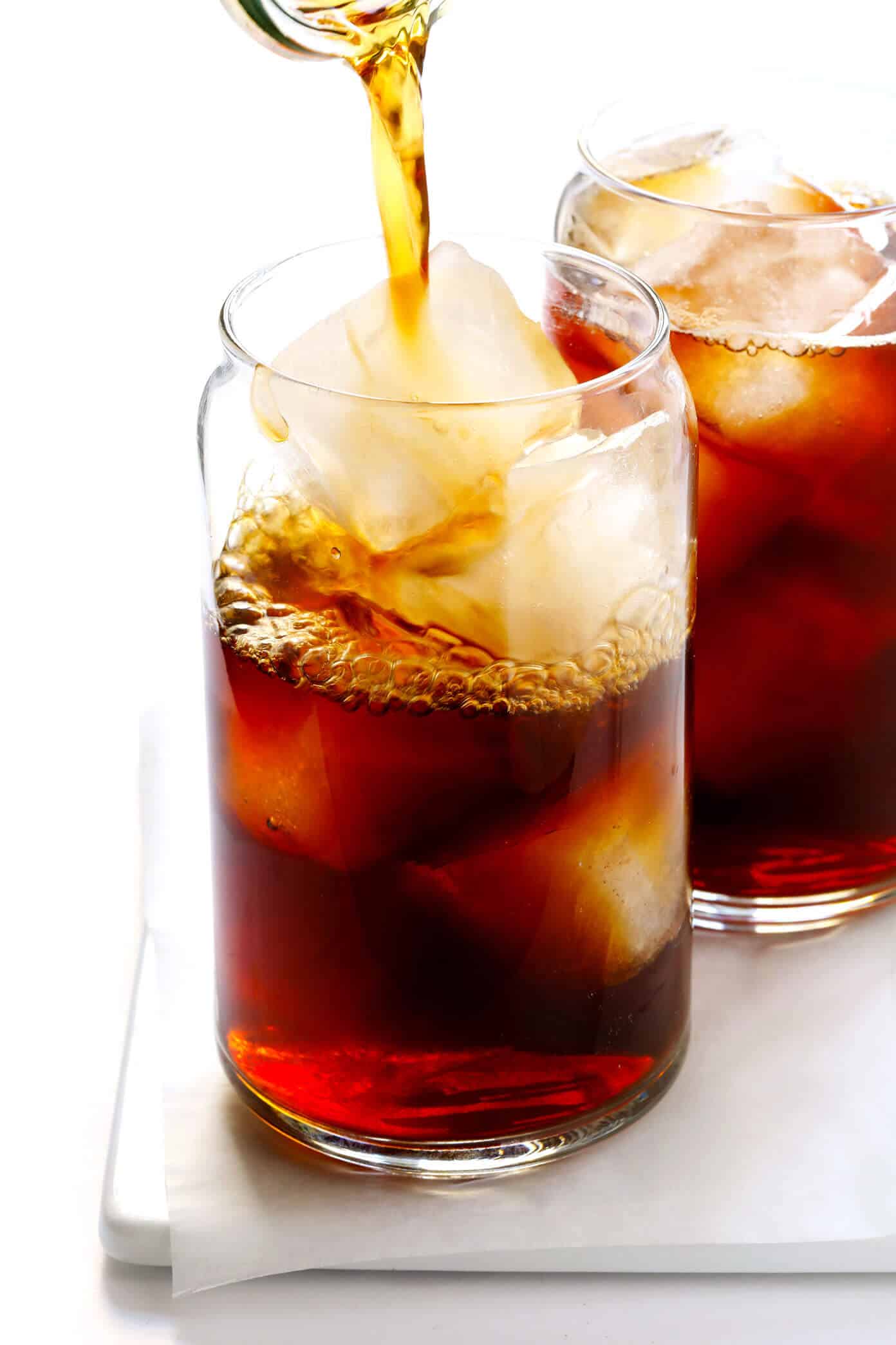 This DIY Pumpkin Cream Cold Brew recipe is inspired by the new Starbucks drink and topped with the yummiest pumpkin foam! Feel free to use your favorite kind of iced coffee, plus whichever type of milk and sweetener you prefer. | gimmesomeoven.com #pumpkin #coldbrew #coffee #breakfast #healthy #drink Pumpkin Cold Brew