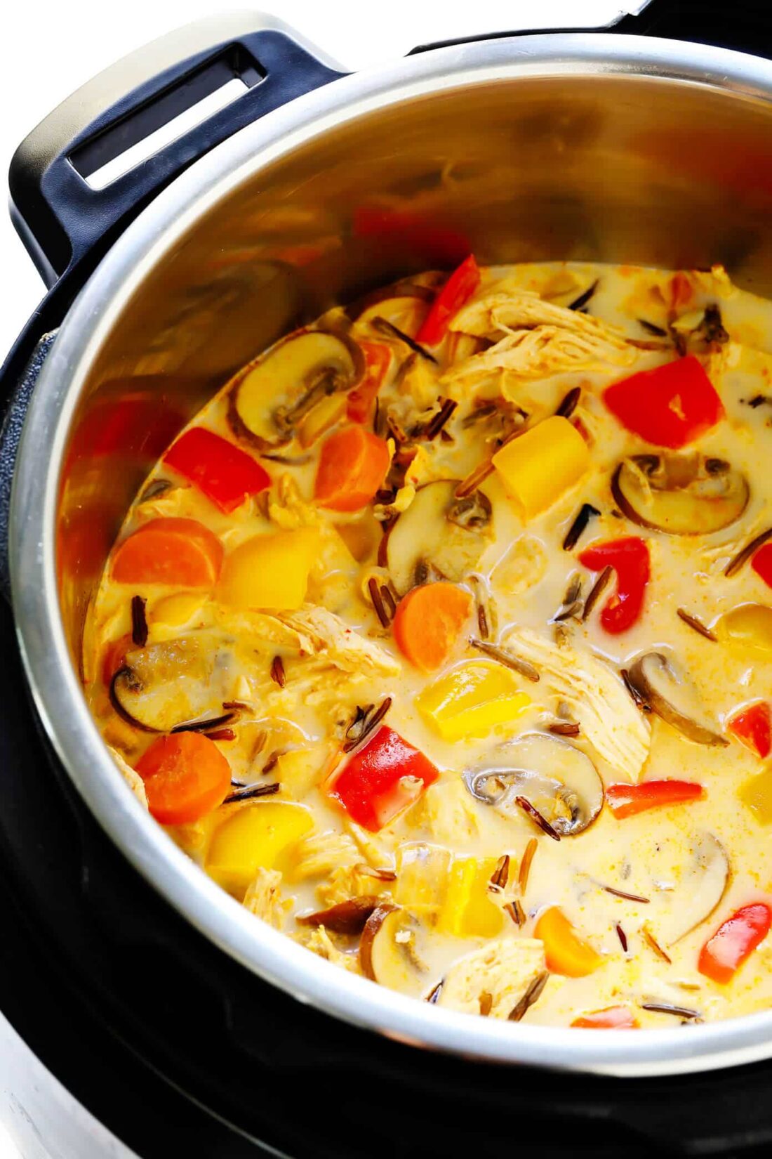 This Thai Chicken Wild Rice recipe is made with lots of veggies and the yummiest coconut ginger Thai curry broth. Plus it's ultra-easy to make in the Instant Pot, Crock-Pot or on the stovetop! | gimmesomeoven.com #chicken #soup #thai #curry #healthy #glutenfree #dinner #mealprep #pressurecooker #slowcooker Thai Curry Chicken Soup