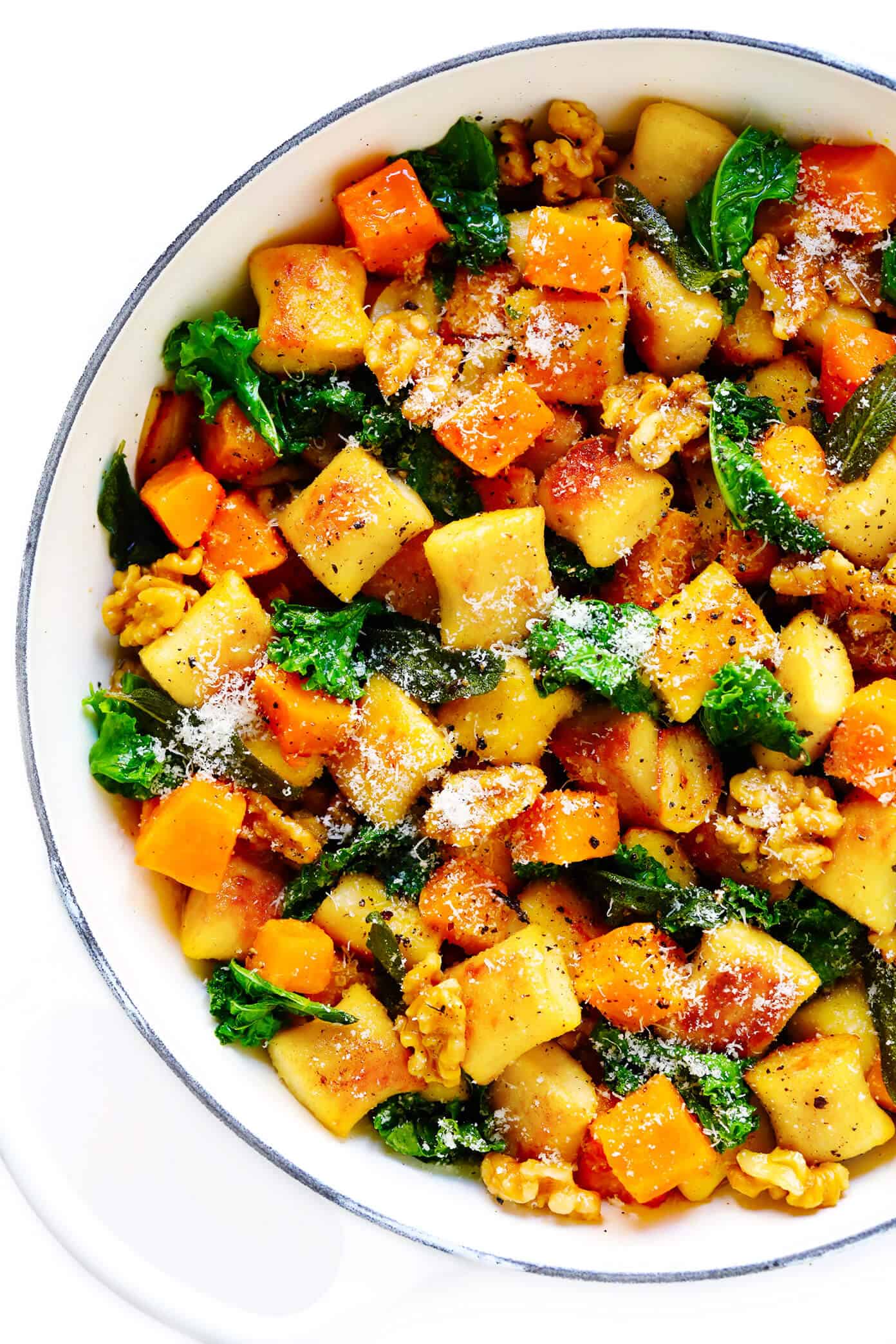 Toasted gnocchi, roasted butternut squash, garlicky kale and walnuts are all tossed together in the yummiest sage brown butter sauce and Parmesan cheese. It's total fall comfort food...and surprisingly easy to make too! | gimmesomeoven.com #gnocchi #italian #dinner #butternutsquash #fall #healthy #vegetarian Gnocchi with Butternut Squash, Kale, Parmesan and Sage Brown Butter Sauce