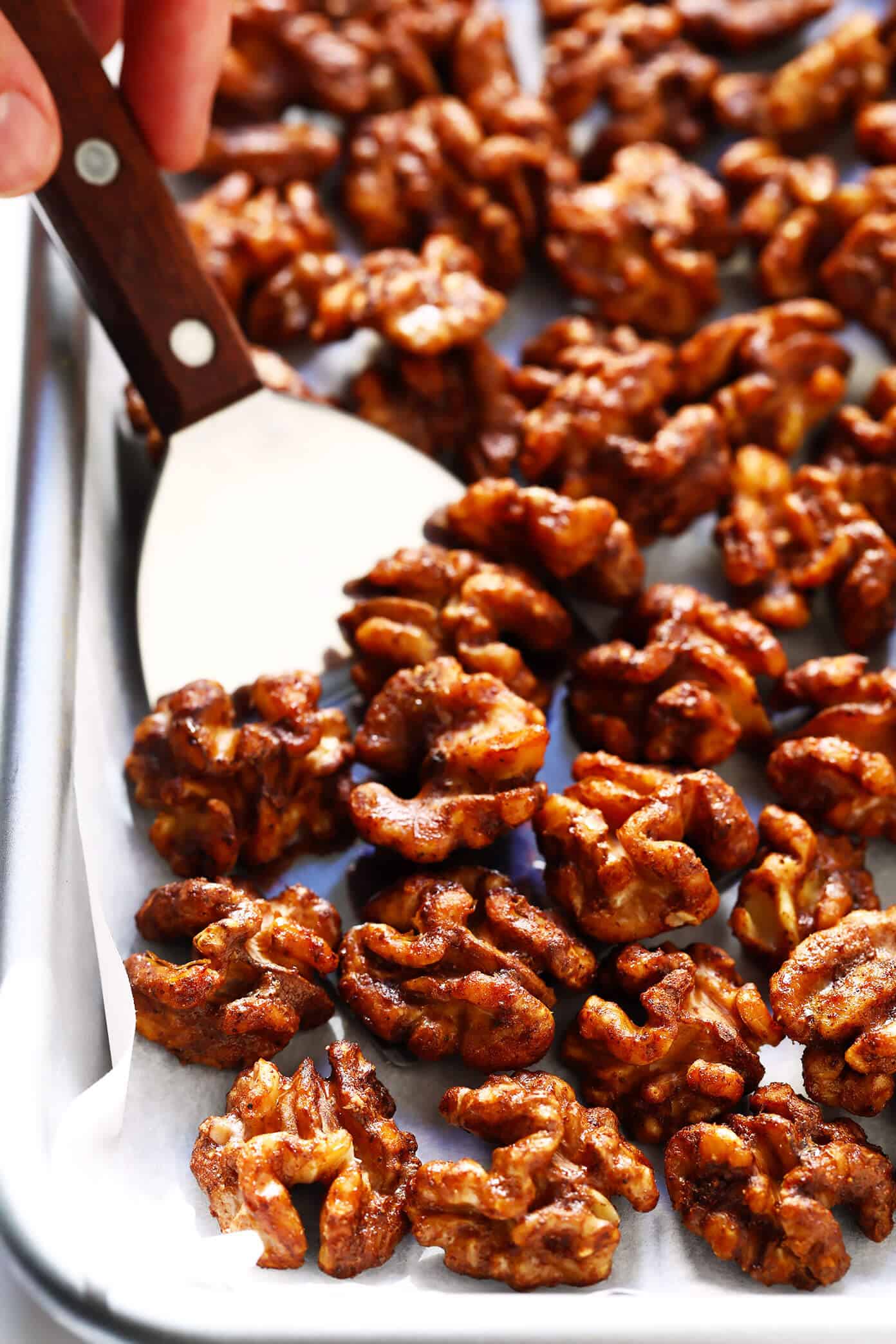 The BEST candied walnuts recipe -- lightly sweetened with a brown sugar cinnamon coating, easy to make in the oven, and irresistibly delicious. These candied nuts are perfect for adding to salads, sweet potatoes, trail mix, or popping plain as a snack! | gimmesomeoven.com #candied #walnuts #nuts #dessert #holiday #gift #diy Candied Nuts Recipe