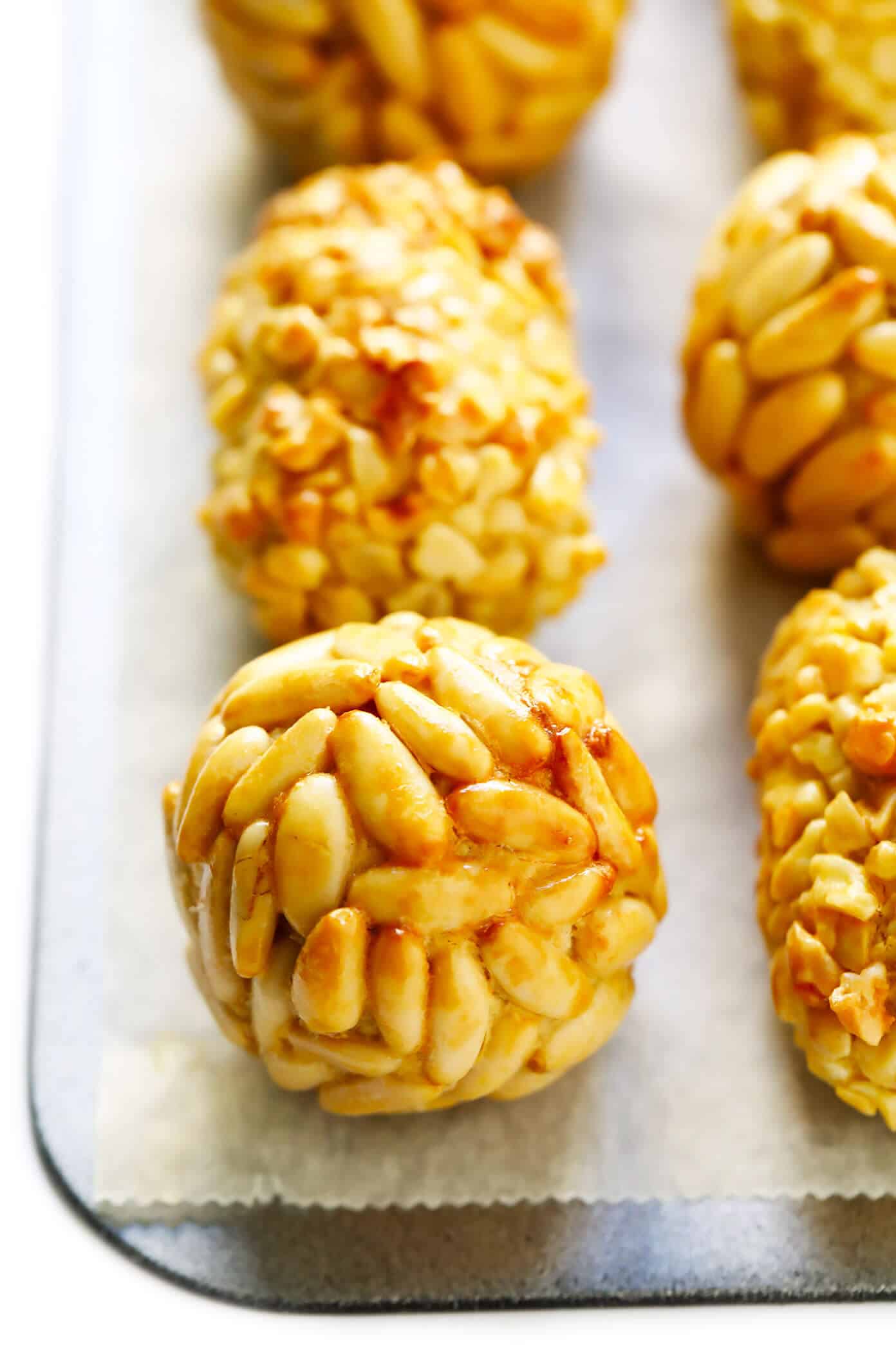 This traditional Catalan panellets recipe is easy to make with just 6 ingredients and fun to customize with different toppings (such as pine nuts, almonds, coconut, cocoa and more). | gimmesomeoven.com #panellets #dessert #catalonia #spain #marzipan Panellets Recipe