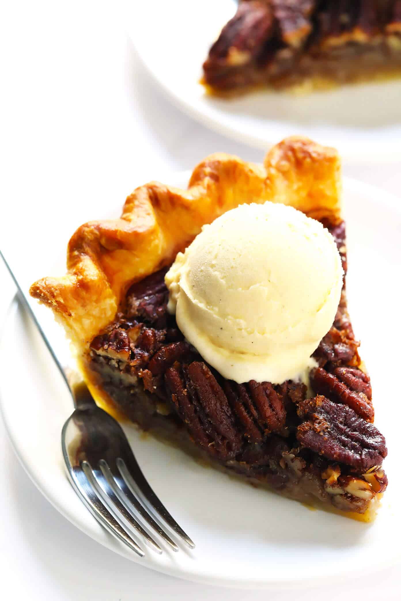 The BEST pecan pie recipe -- easy to make, naturally sweetened with maple syrup (no corn syrup!), and SO delicious. The perfect dessert for holidays like Thanksgiving or Christmas, or anytime you're craving some pie! | gimmesomeoven.com #pecan #pie #dessert #healthy #sweets #thanksgiving #christmas #holiday Homemade Pecan Pie with Ice Cream