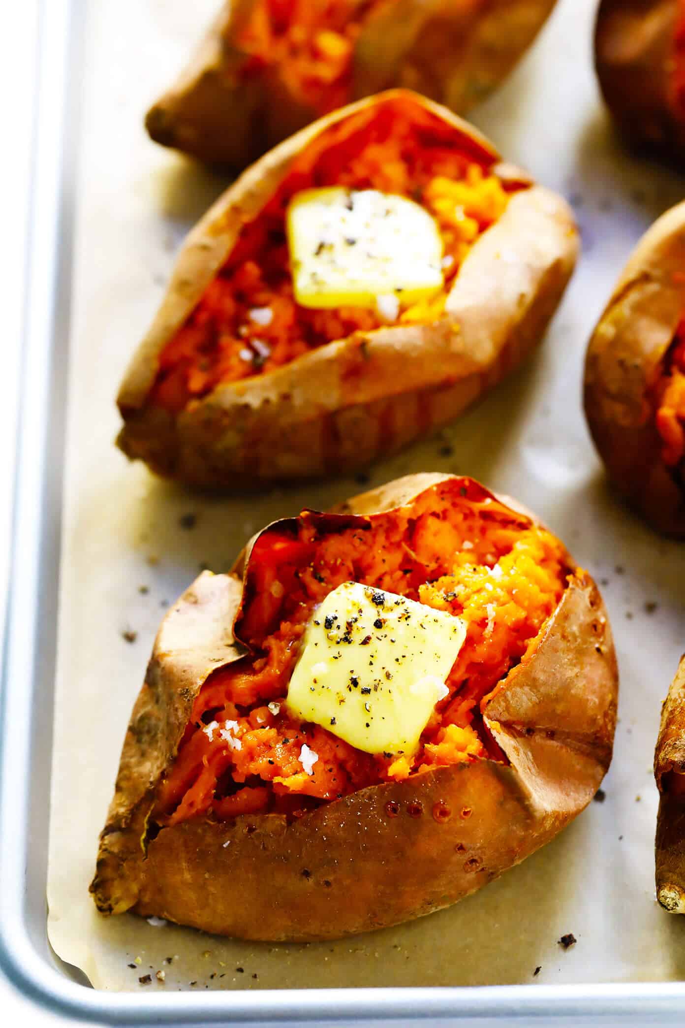 My favorite method for how to bake sweet potatoes in the oven that are perfectly crispy on the outside and soft on the inside. Plus, lots of ideas for loaded potato toppings you can add on too! | gimmesomeoven.com #sweetpotato #healthy #glutenfree #vegan #vegetarian #dinner #side Baked Sweet Potatoes
