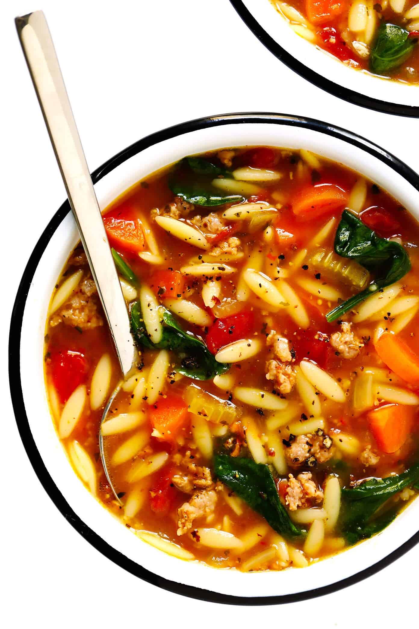 This Italian Sausage and Orzo Soup recipe is easy to make with your choice of veggies, it's seasoned with a zesty garlic tomato broth, and tastes SO cozy and comforting. The perfect easy dinner recipe that also makes great leftovers for later! | gimmesomeoven.com #italian #soup #pasta #orzo #sausage #dinner #freezermeal #mealprep #healthy Italian Sausage, Orzo, Spinach and Tomato Soup Recipe