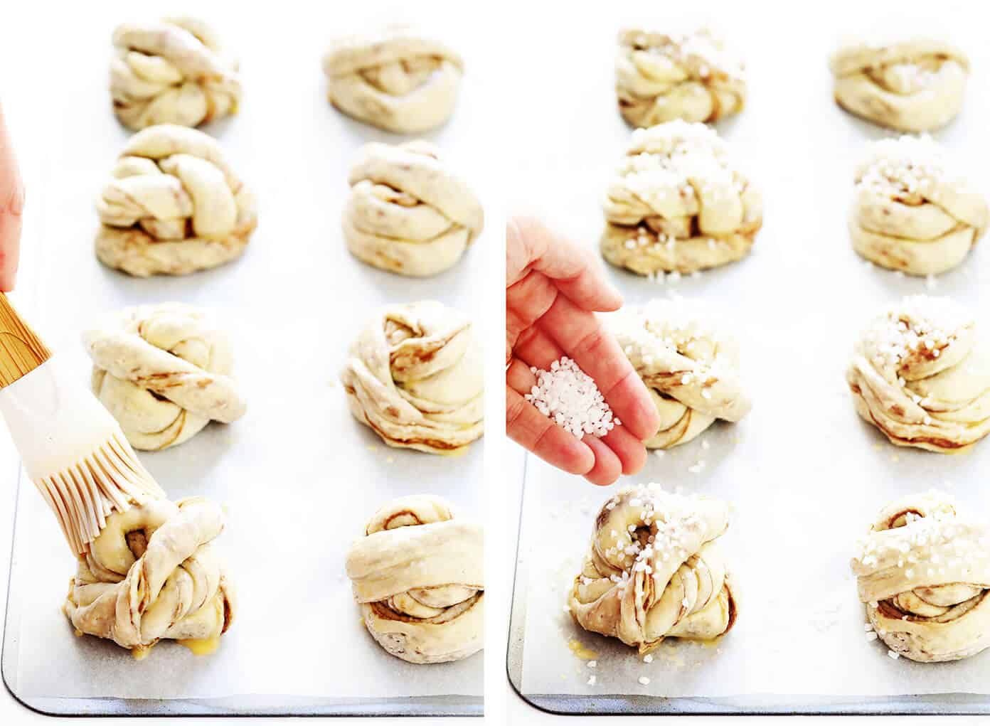 This traditional Swedish kanelbullar (cinnamon buns) recipe is made with a perfectly soft and chewy cardamom dough, a buttery cinnamon-sugar filling, and twisted into cute little knots. Top these rolls with crunchy sweet pearl sugar or any type of sugar that you have on hand! | gimmesomeoven.com #swedish #cinnamon #buns #rolls #breakfast #brunch #sweet #vegetarian #vegan Sprinkling Pearl Sugar on Kanelbullar