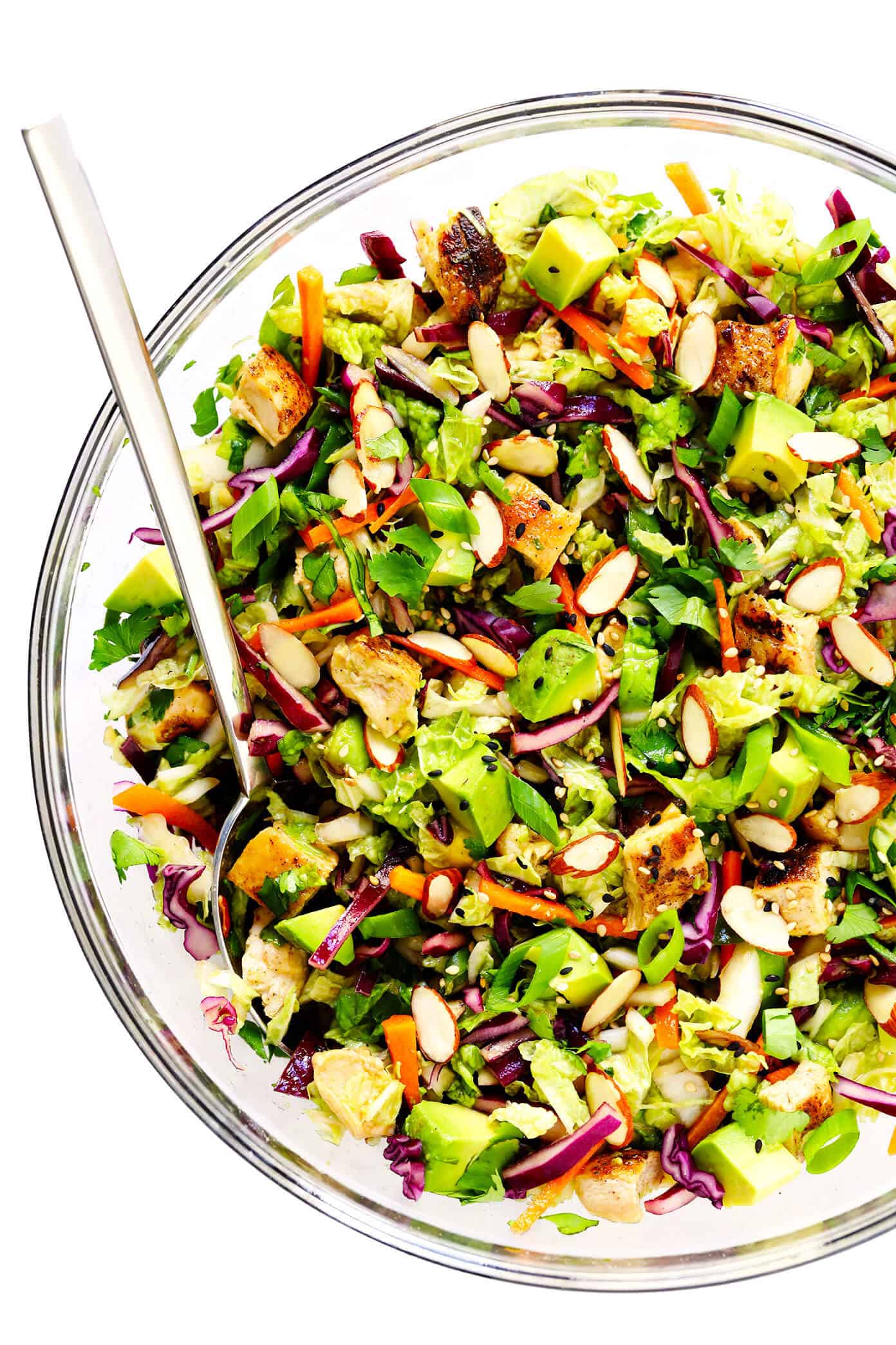 This Sesame Chicken Salad recipe is made with crisp cole slaw and carrots, zesty chicken, crunchy toasted almonds, creamy avocado, lots of fresh cilantro and a quick sesame soy vinaigrette. It's a simple salad recipe that always hits the spot! | gimmesomeoven.com #salad #sesame #asian #almond #avocado #chicken #vinaigrette #dressing #mealprep #healthy #glutenfree How To Make Salad