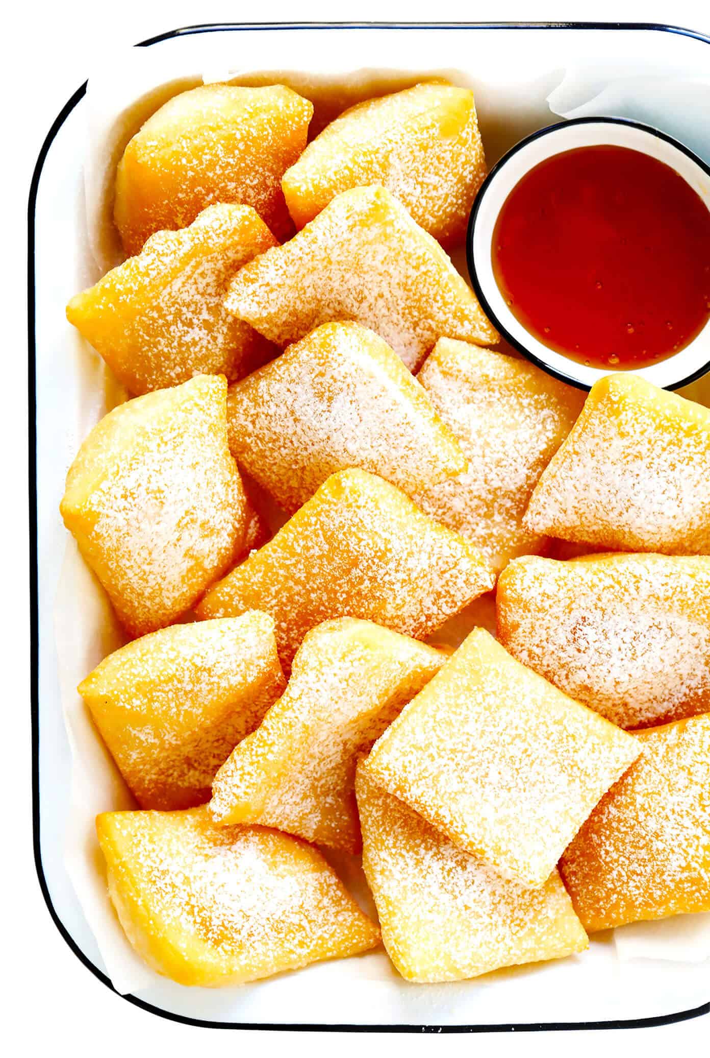 This restaurant-style sopapilla recipe is easy to make at home with pantry ingredients and always a crowd fave. Sprinkle your sopapillas in powdered sugar or dip in cinnamon-sugar -- up to you! | gimmesomeoven.com #sopapillas #dessert #mexican #texmex #donut #frybread #sweet Sopapillas