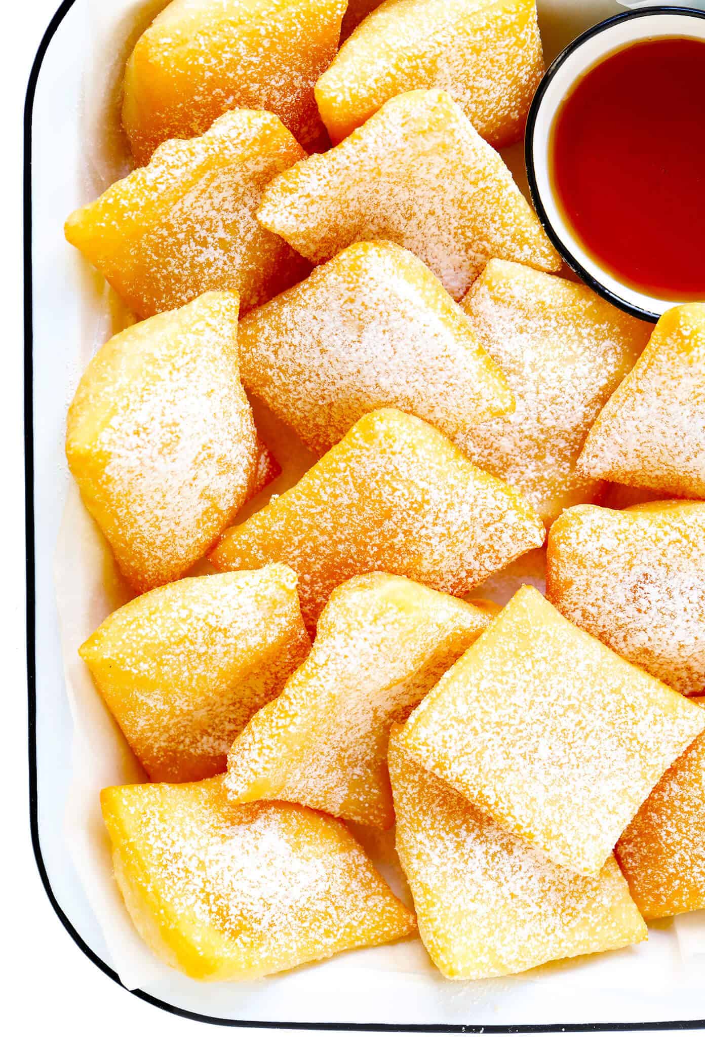 This restaurant-style sopapilla recipe is easy to make at home with pantry ingredients and always a crowd fave. Sprinkle your sopapillas in powdered sugar or dip in cinnamon-sugar -- up to you! | gimmesomeoven.com #sopapillas #dessert #mexican #texmex #donut #frybread #sweet Homemade Sopapilla Recipe