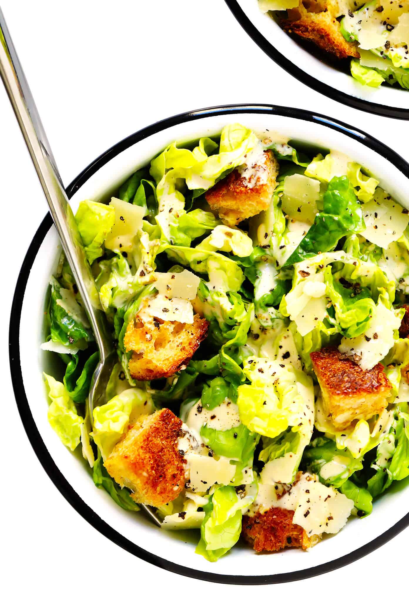 The BEST Caesar Dressing recipe -- quick and easy to make, full of the best creamy, savory, umami flavors, and downright irresistible on a classic Caesar salad. | gimmesomeoven.com #caesar #salad #dressing #creamy #italian #dinner #recipe Caesar Salad in Bowls with Homemade Croutons